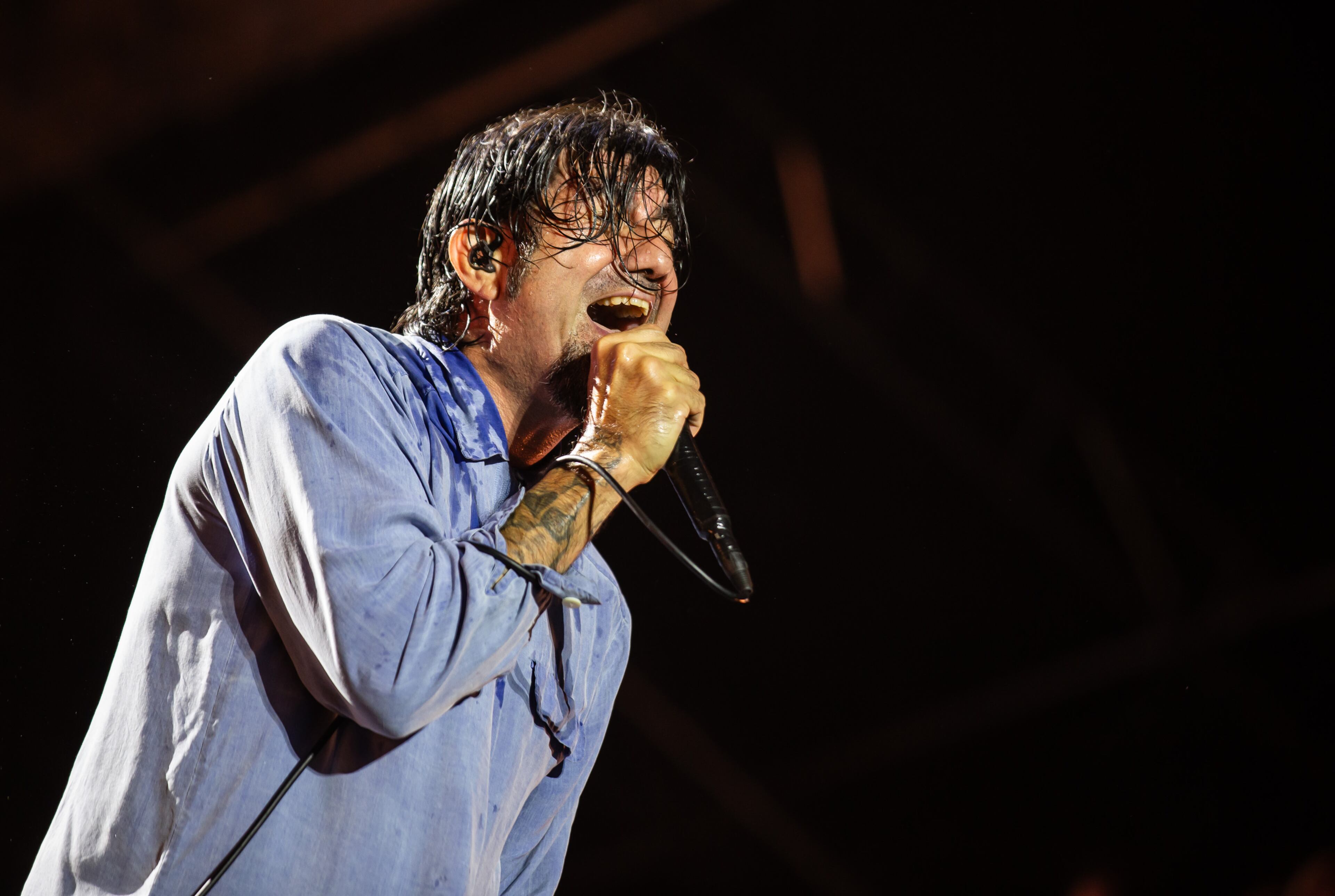 The Deftones closed out Night 1 of Shaky Knees to a packed Piedmont Park on Friday, Sept. 19, 2025. Lead singer Chino Moreno was drenched in sweat in his blue button-up, but his vocals and energy didn’t seem defeated by the Atlanta heat. (Ryan Fleisher for the AJC)