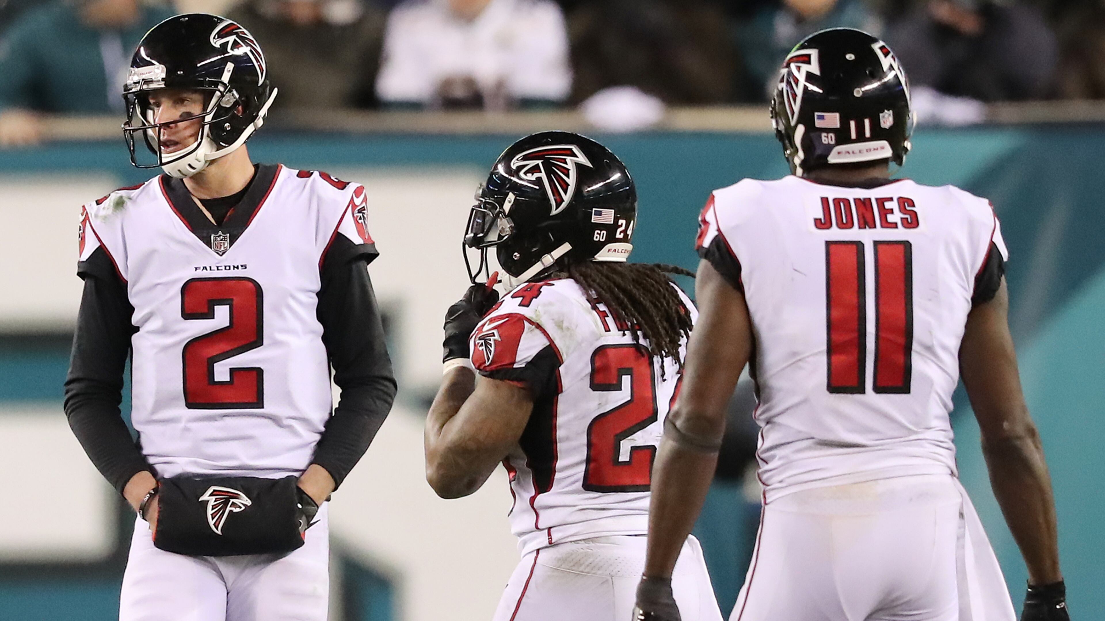 Matt Ryan, Devonta Freeman, and Julio Jones walk off the field after final drive against the Eagles Saturday, Jan. 13, 2018, in Philadelphia.