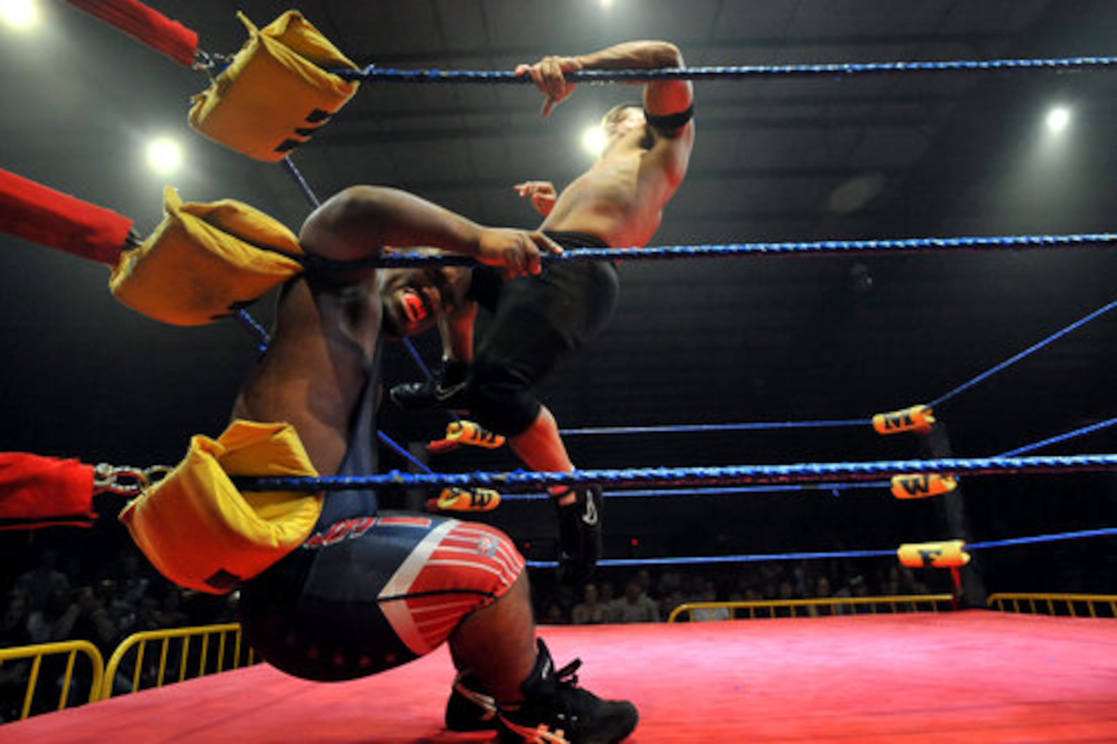 "J-Mazing" Jordan Rafael kicks Ricky Benjamin (real name Ricky Sells) in the head.