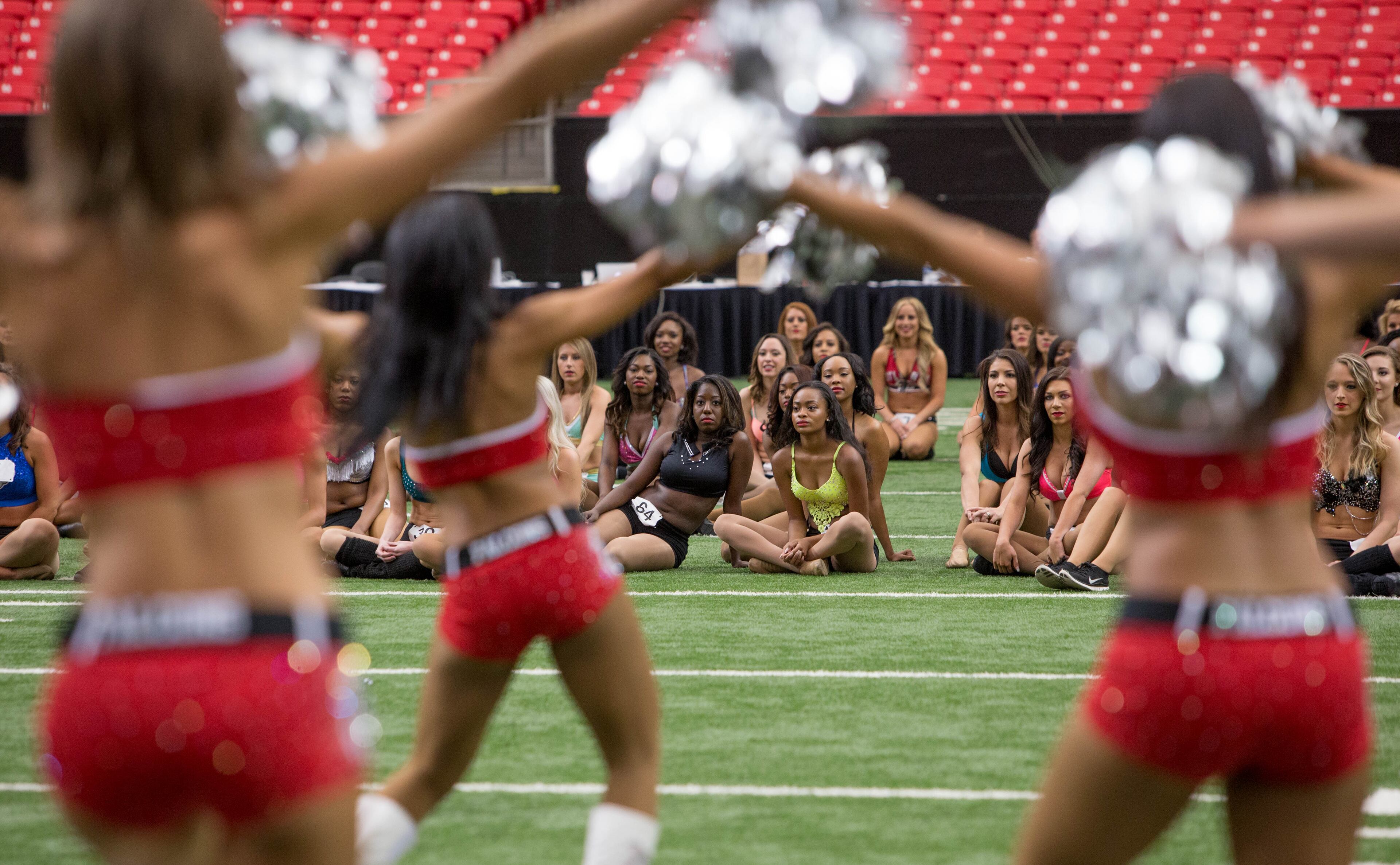 Contestants watch as current Atlanta Falcons Cheerleaders perform before cheerleader tryouts begin at the Georgia Dome, Sunday, April 24, 2016, in Atlanta. A total of 33 advanced to the finals, which will be held on Wednesday at Terminal West. BRANDEN CAMP/SPECIAL