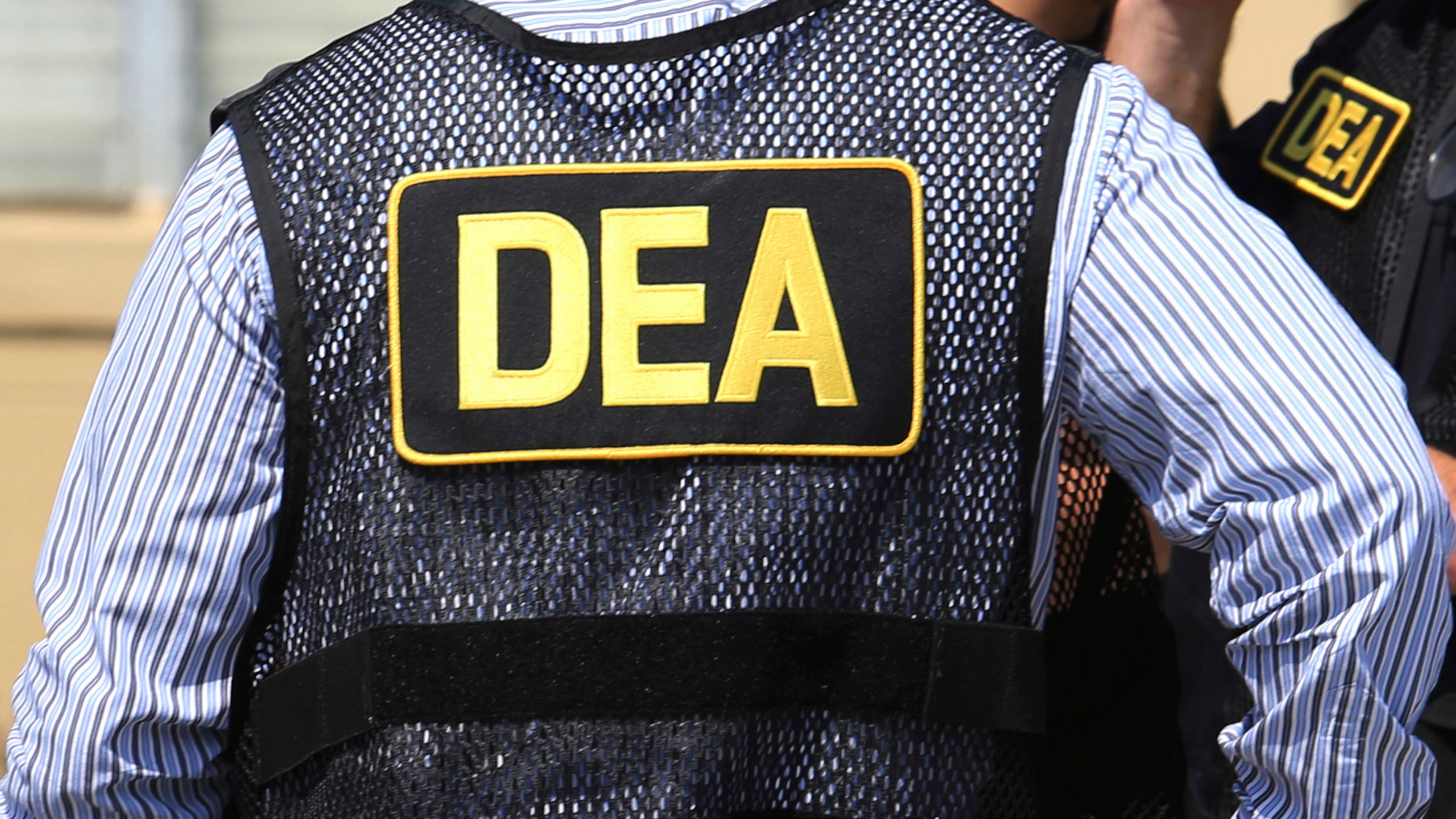 FILE - Lettering marks Drug Enforcement Administration agent's uniforms in Florida, June 13, 2016. (Joe Burbank/Orlando Sentinel via AP, File/Orlando Sentinel via AP, File)