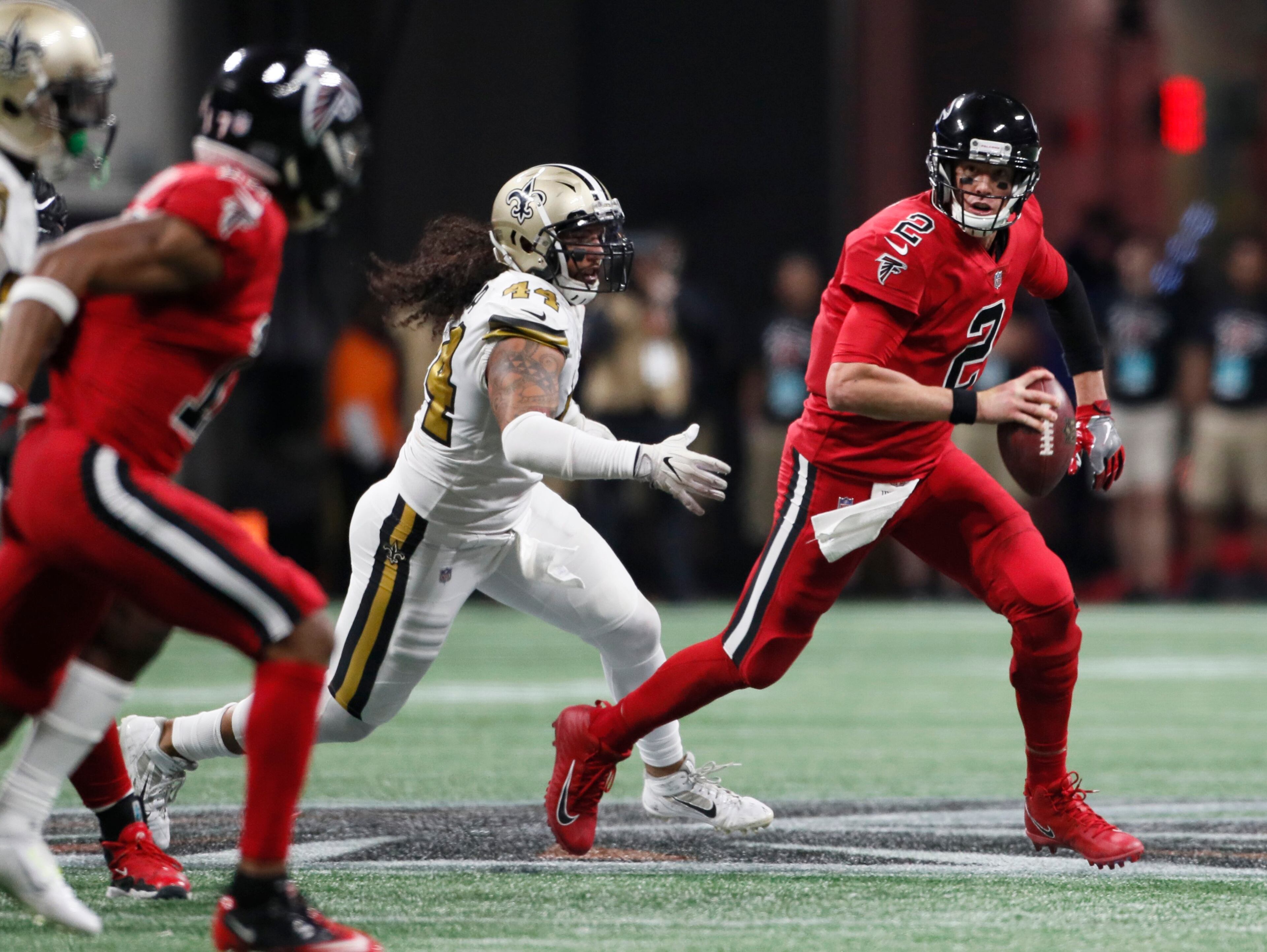 12/7/17 - Atlanta - Atlanta Falcons quarterback Matt Ryan (2) rolls away from pressure in the second half, and threw the ball out of bounds. Atlanta Falcons play their rival, the New Orleans Saints in an NFL football game at Mercedes-Benz Stadium in Atlanta. BOB ANDRES /BANDRES@AJC.COM