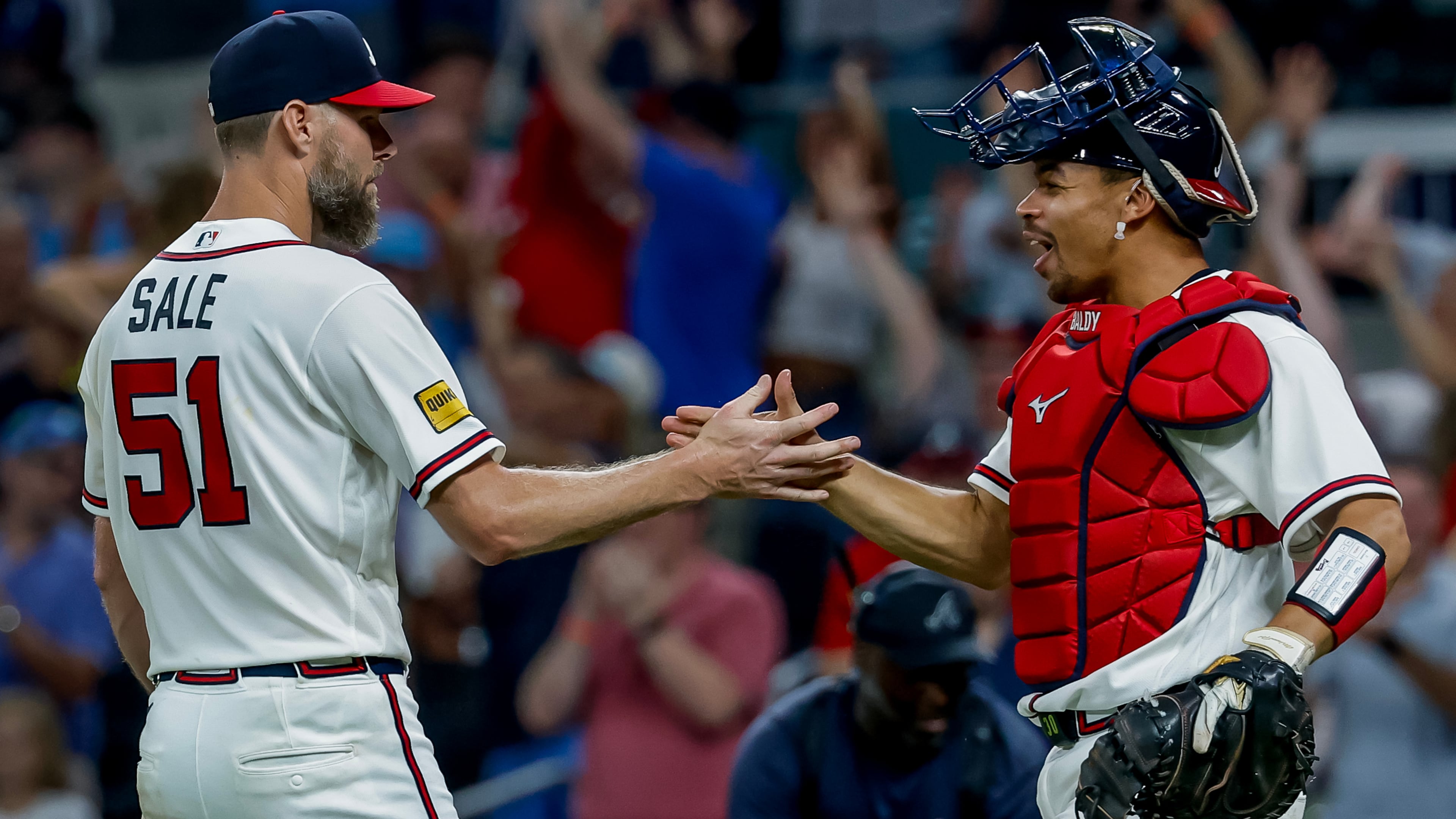 Atlanta Braves pitcher Chris Sale (51) celebrates with catcher Drake Baldwin after Sale won a complete game shutout of the Los Angeles Dodgers during the ninth inning of a baseball game, Thursday, Aug. 27, 2026, in Atlanta. (AP Photo/Erik S. Lesser)