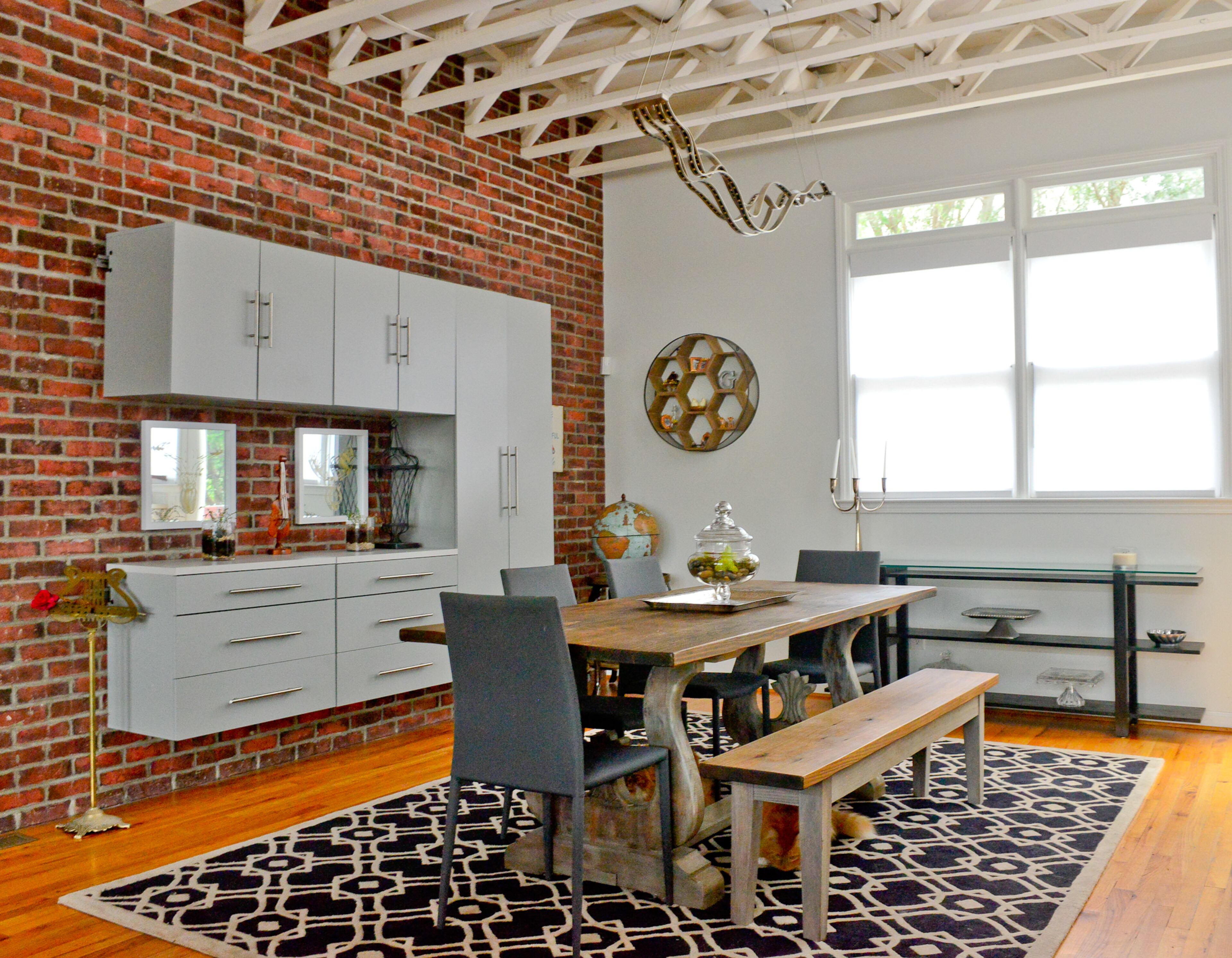 The wood farmhouse table is the couple's favorite piece of furniture. "We've never had a table that could seat more than four people, and we love throwing parties and gathering around with friends and food." Catherine Giel said. The lyre detail in the base of the table adds to the musical theme that flows throughout the Castleberry Hill residence, which is on the neighborhood's Oct. 22 loft tour.