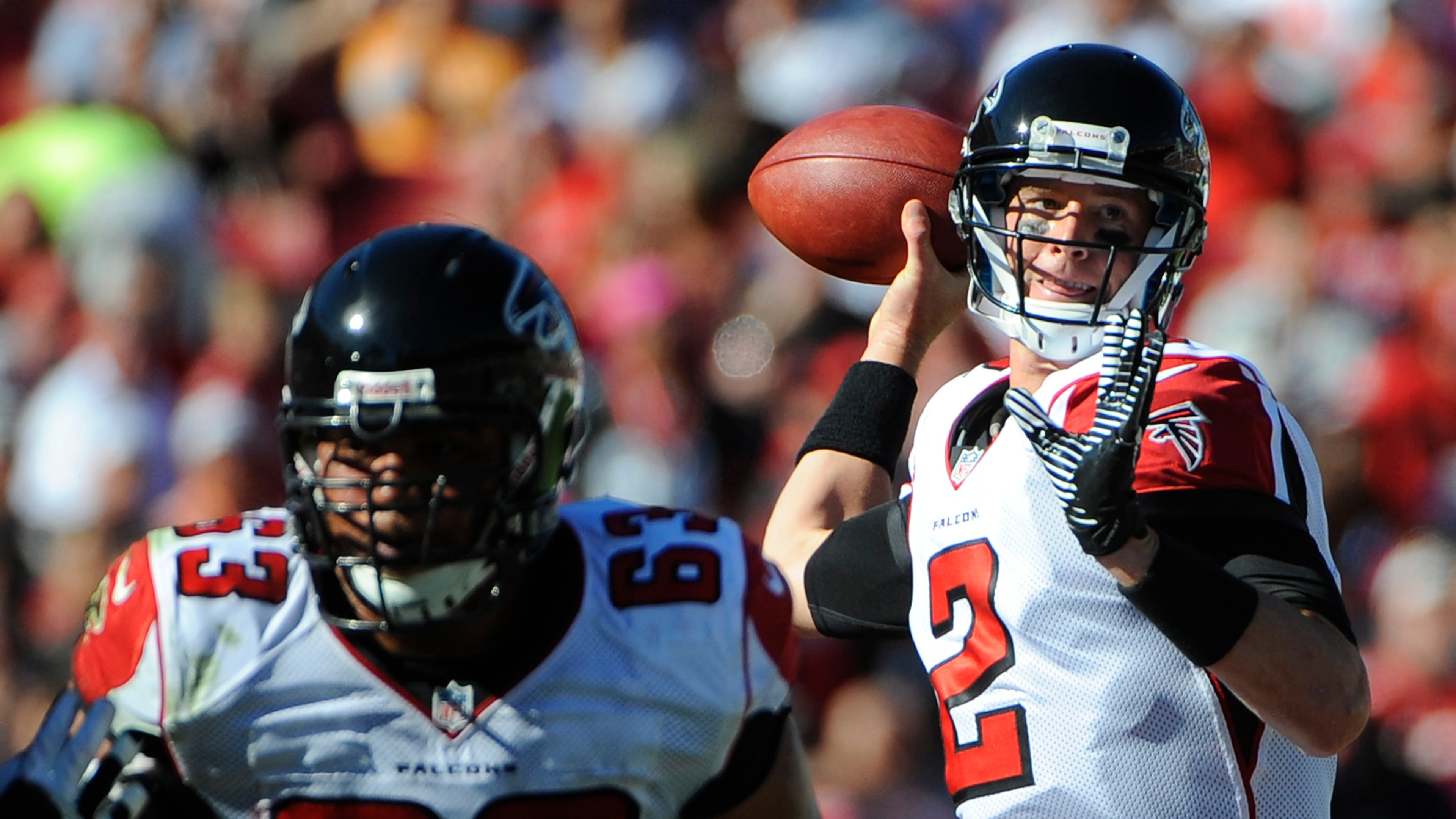 Atlanta Falcons quarterback Matt Ryan (2) throws a pass as teammate guard Justin Blalock defends during the second quarter of an NFL football game against the Tampa Bay Buccaneers Sunday, Nov. 25, 2012, in Tampa, Fla. (AP Photo/Brian Blanco)