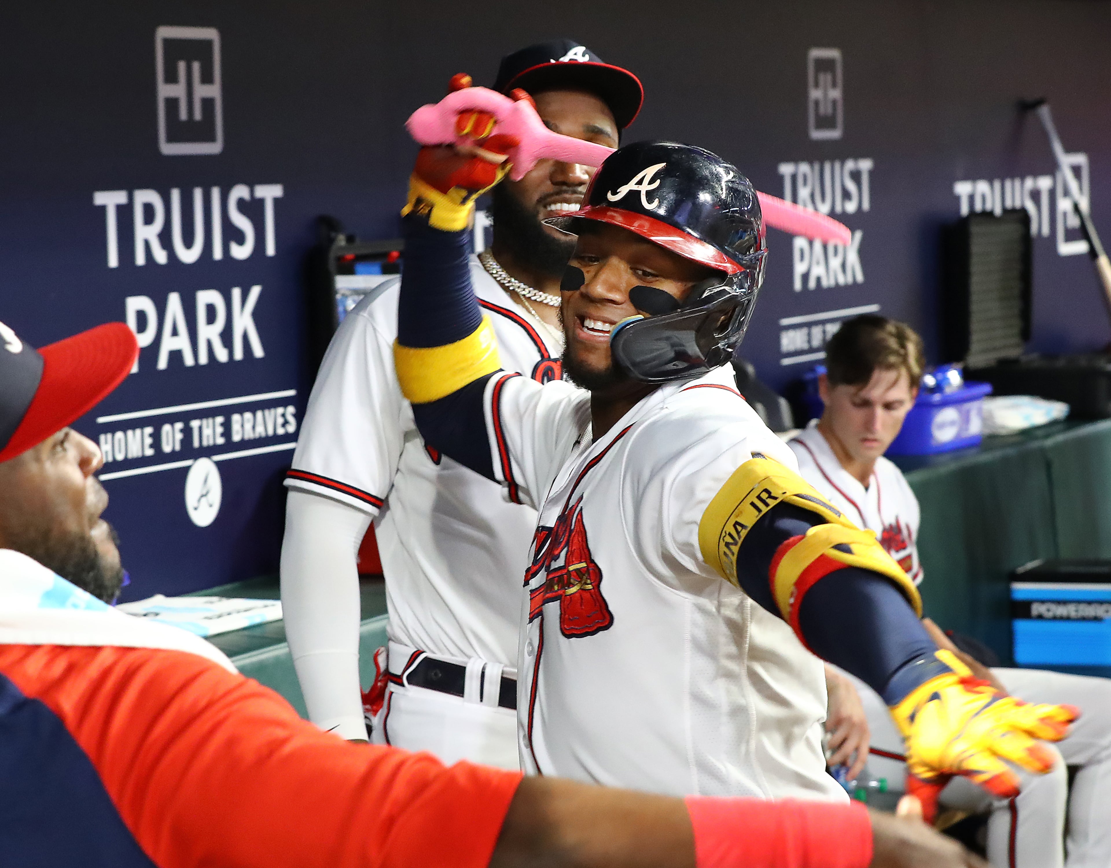 083122 Atlanta: Atlanta Braves designated hitter Ronald Acuna swings the pink sword in the dugout celebrating his solo home run for a 3-0 lead over the Colorado Rockies during the fifth inning in a MLB baseball game on Wednesday, August 31, 2022, in Atlanta. “Curtis Compton / Curtis Compton@ajc.com