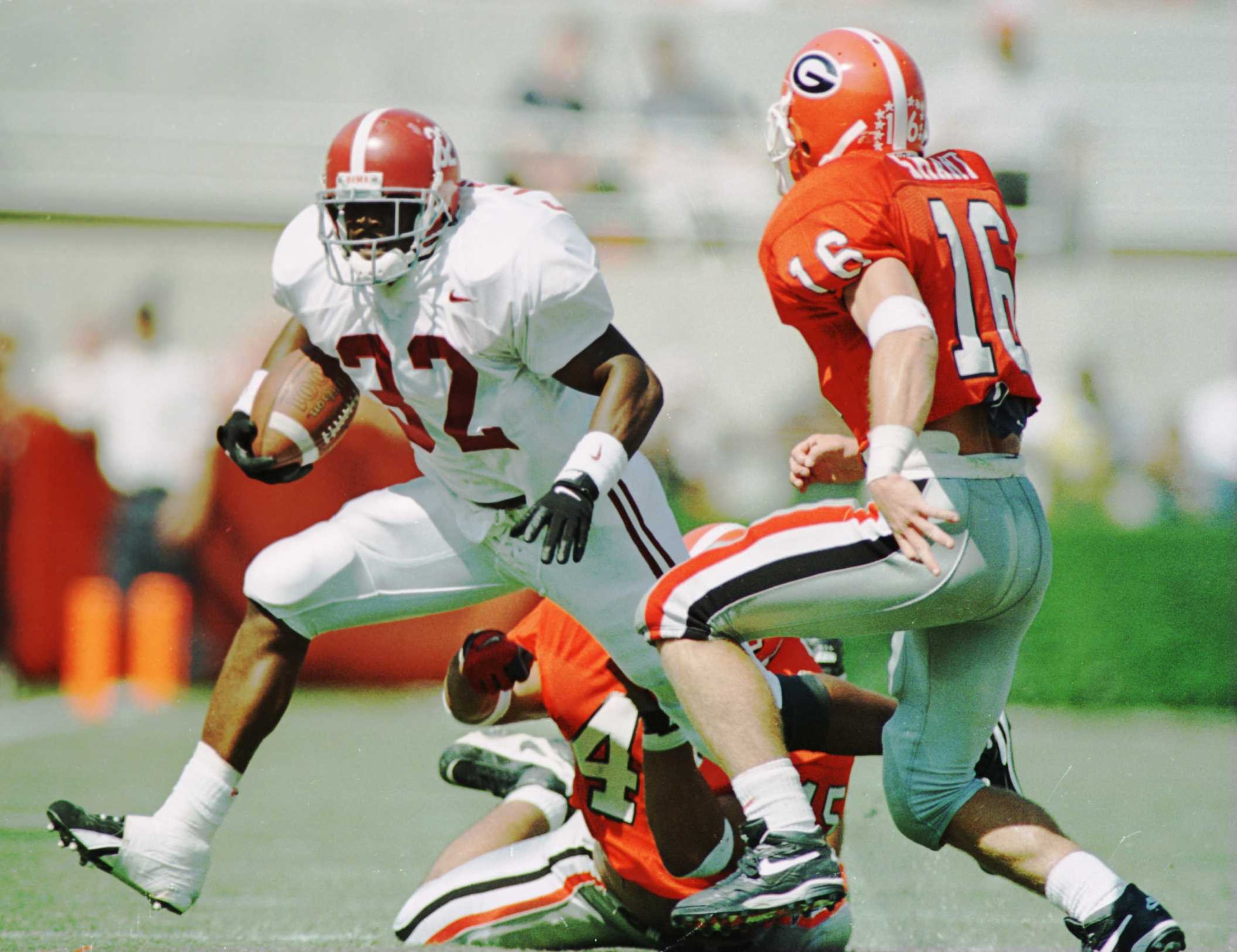 Georgia's Kirby Smart tries to stop Alabama's Curtis Alexander in 1995. Matthew Stockman/ALLSPORT
