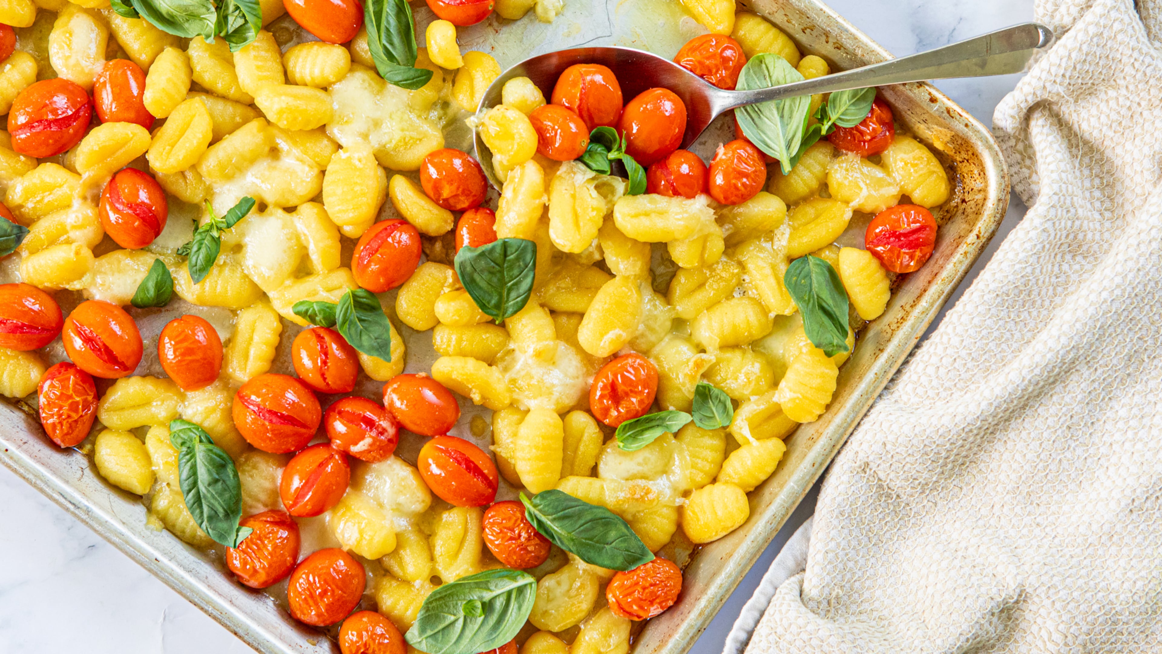 Sheet Pan Gnocchi with Tomatoes and Mozzarella. (Aaliyah Man for the AJC/Food styling by Kate Williams)