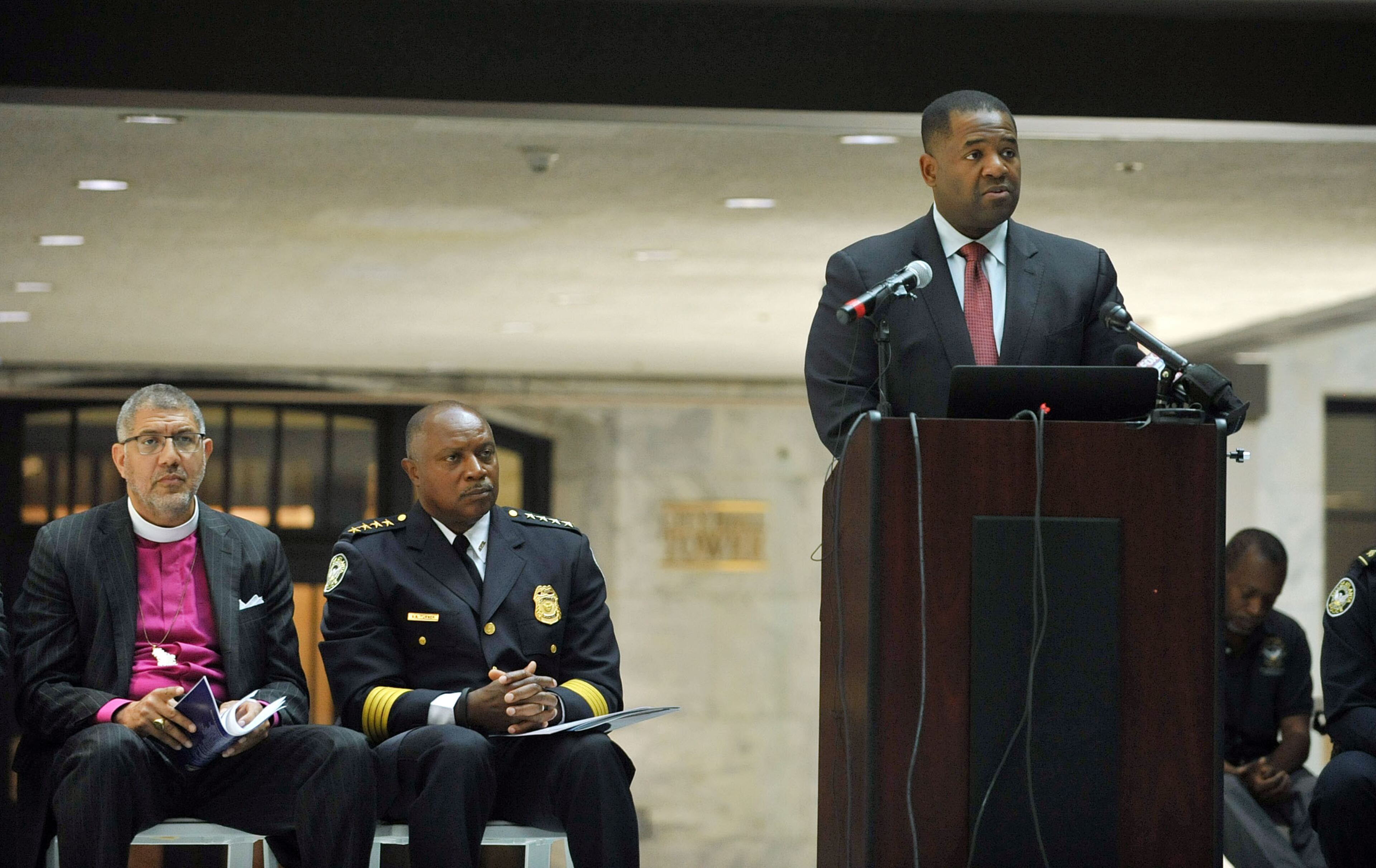 Atlanta City Council President Ceasar C. Mitchell gives remarks during the service. The Atlanta Police Department recognized 82 fallen officers during the 24th Annual Police Memorial Service at the Atlanta City Hall atrium, Tuesday, May 5, 2015. The Right Rev. Robert C. Wright of the Episcopal Diocese of Atlanta was the keynote speaker. Additional speakers included Atlanta Police Chief George N. Turner, Michael Geisler, Chief Operating Officer and Council member C.T. Martin, Public Safety Chair. KENT D. JOHNSON /KDJOHNSON@AJC.COM