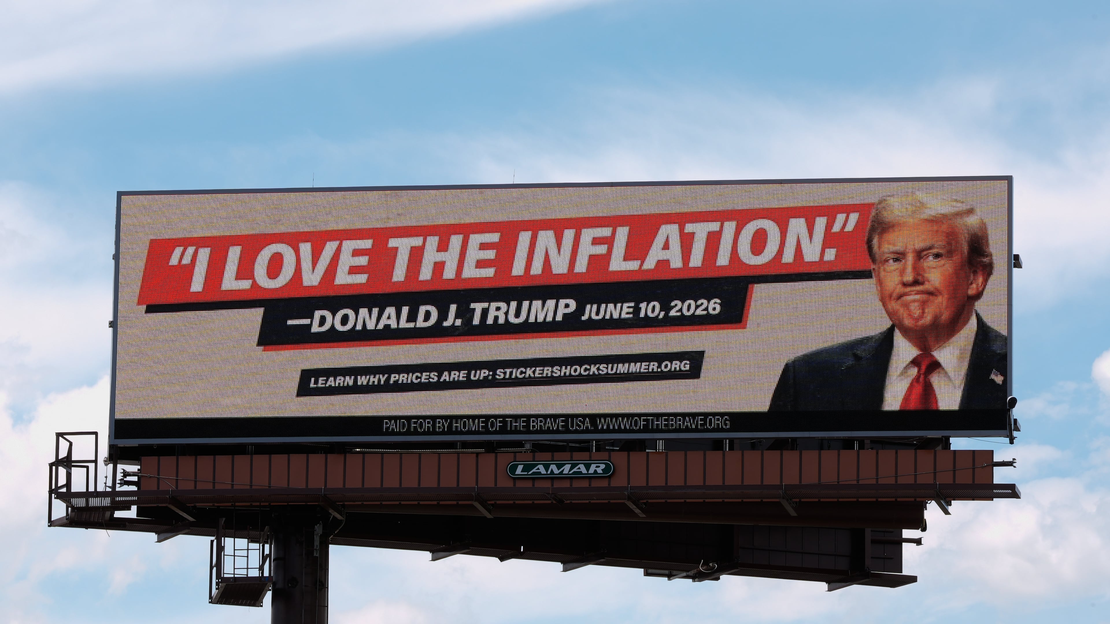 An electronic billboard with an image of President Donald Trump reads "I love the inflation." - Donald J. Trump June 10, 2026," is seen near I-74 in Cincinnati, Tuesday, June 16, 2026. (AP Photo/Carolyn Kaster)