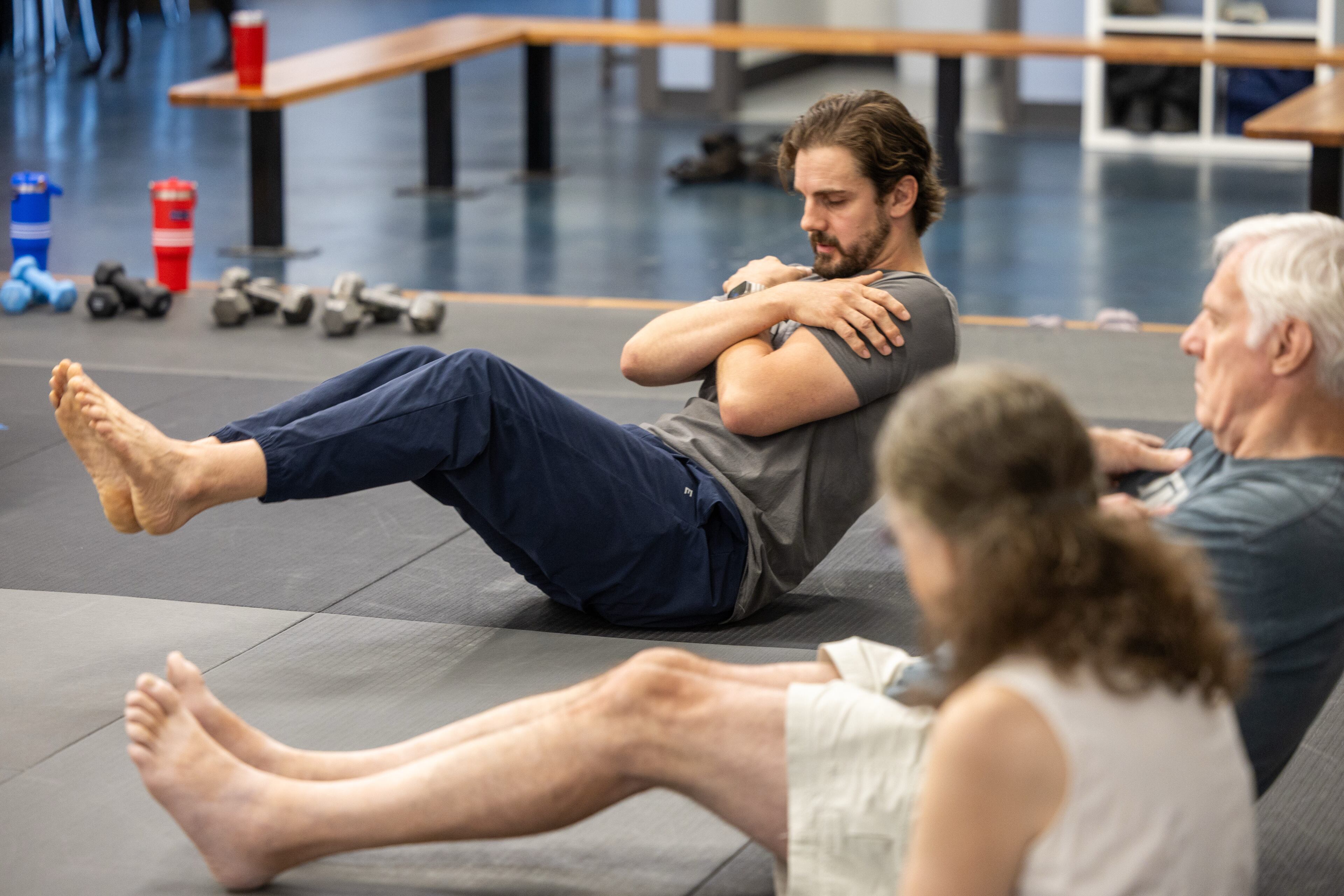Matt Scheib demonstrates falling backward safely during Atlanta Judo Midtown's six-week program for older adults. The program blends strength, balance and Judo-based falling techniques, known as ukemi, to teach participants how to prevent falls and reduce the risk of serious injury if they do happen. (Phil Skinner for the AJC)