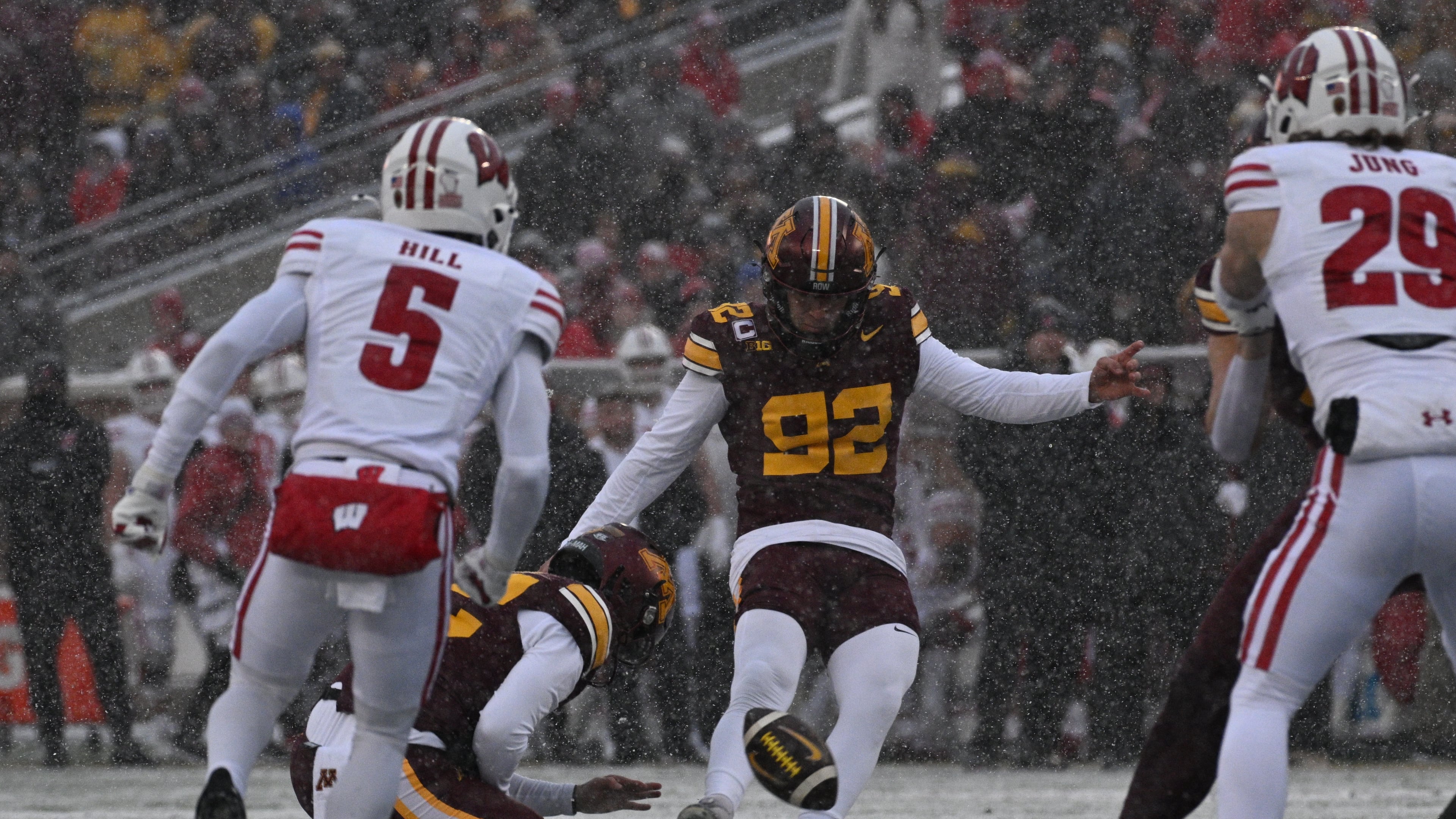 FILE - Minnesota kicker Brady Denaburg attempts a field goal during the first half of an NCAA college football game against Wisconsin Nov. 29, 2025, in Minneapolis. (AP Photo/Tom Baker, File)