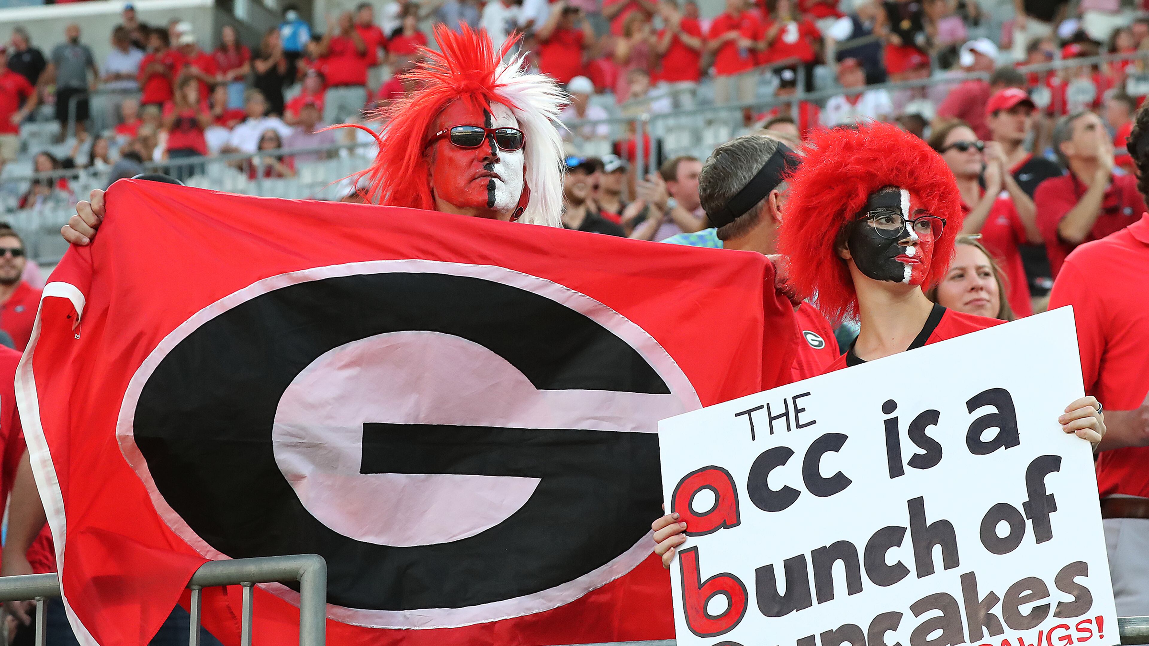Georgia fans Darrell Edquist and his daughter Alex are on hand to cheer on the Dawgs against Clemson in a NCAA college football game on Saturday, Sept 4, 2021, in Charlotte. “Curtis Compton / Curtis.Compton@ajc.com”