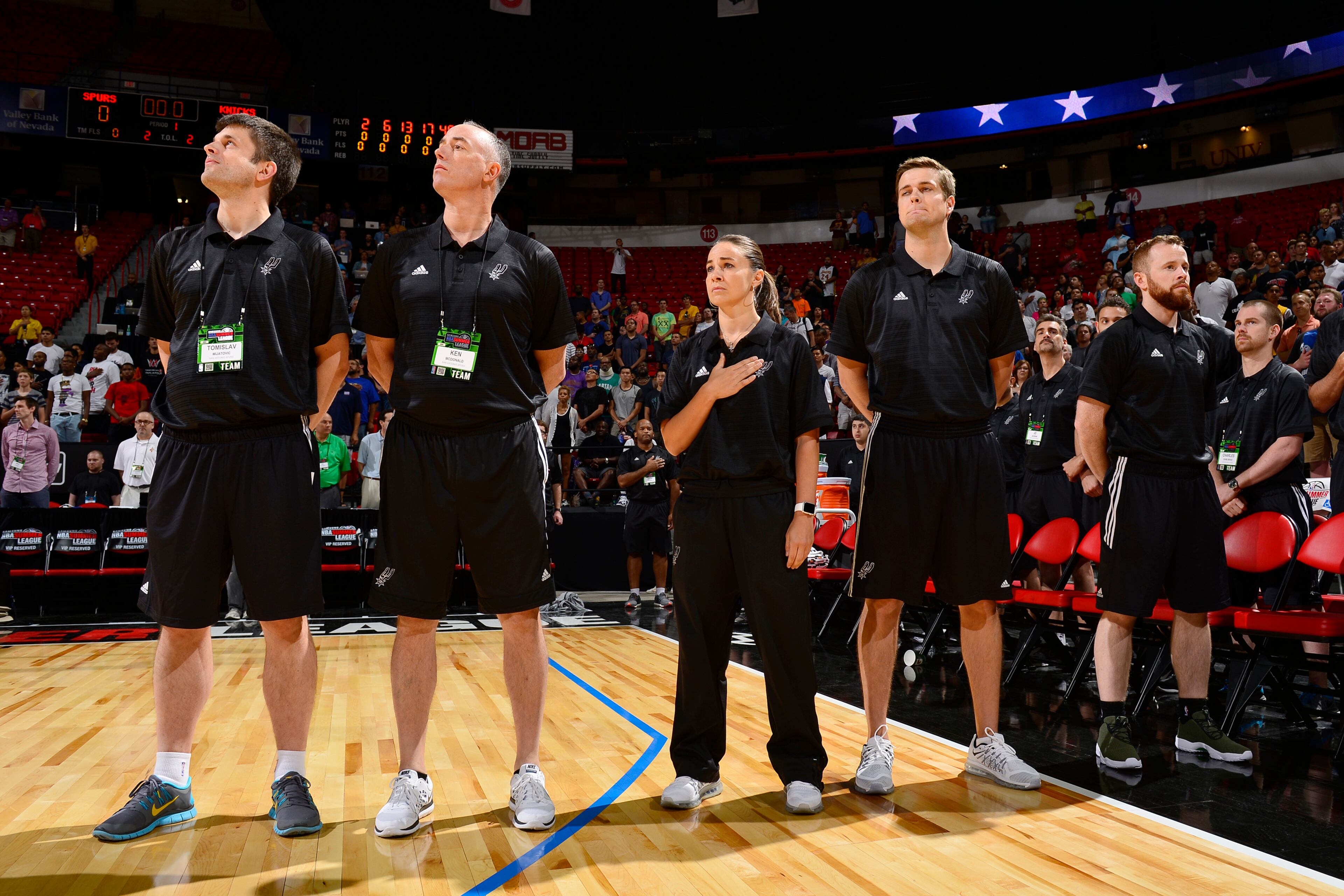 LAS VEGAS, NV - JULY 11: San Antonio Spurs head coach, Becky Hammon during the national anthemn before the game against the New York Knicks on July 11, 2015 at Thomas And Mack Center, Las Vegas, Nevada. NOTE TO USER: User expressly acknowledges and agrees that, by downloading and or using this Photograph, user is consenting to the terms and conditions of the Getty Images License Agreement. Mandatory Copyright Notice: Copyright 2015 NBAE (Photo by David Dow/NBAE via Getty Images)
