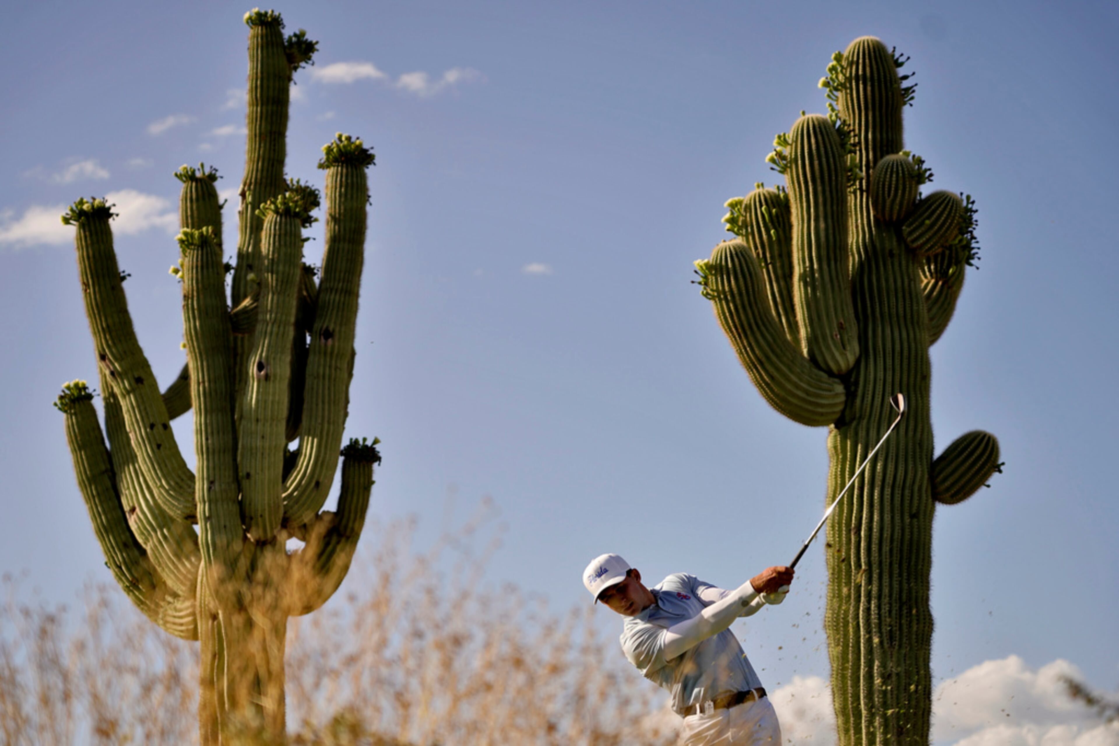 Florida golfer Matthew Kress hits from the 16th tee during the final round of the NCAA college men's match play golf championship, Wednesday, May 31, 2023, in Scottsdale, Ariz. (AP Photo/Matt York)