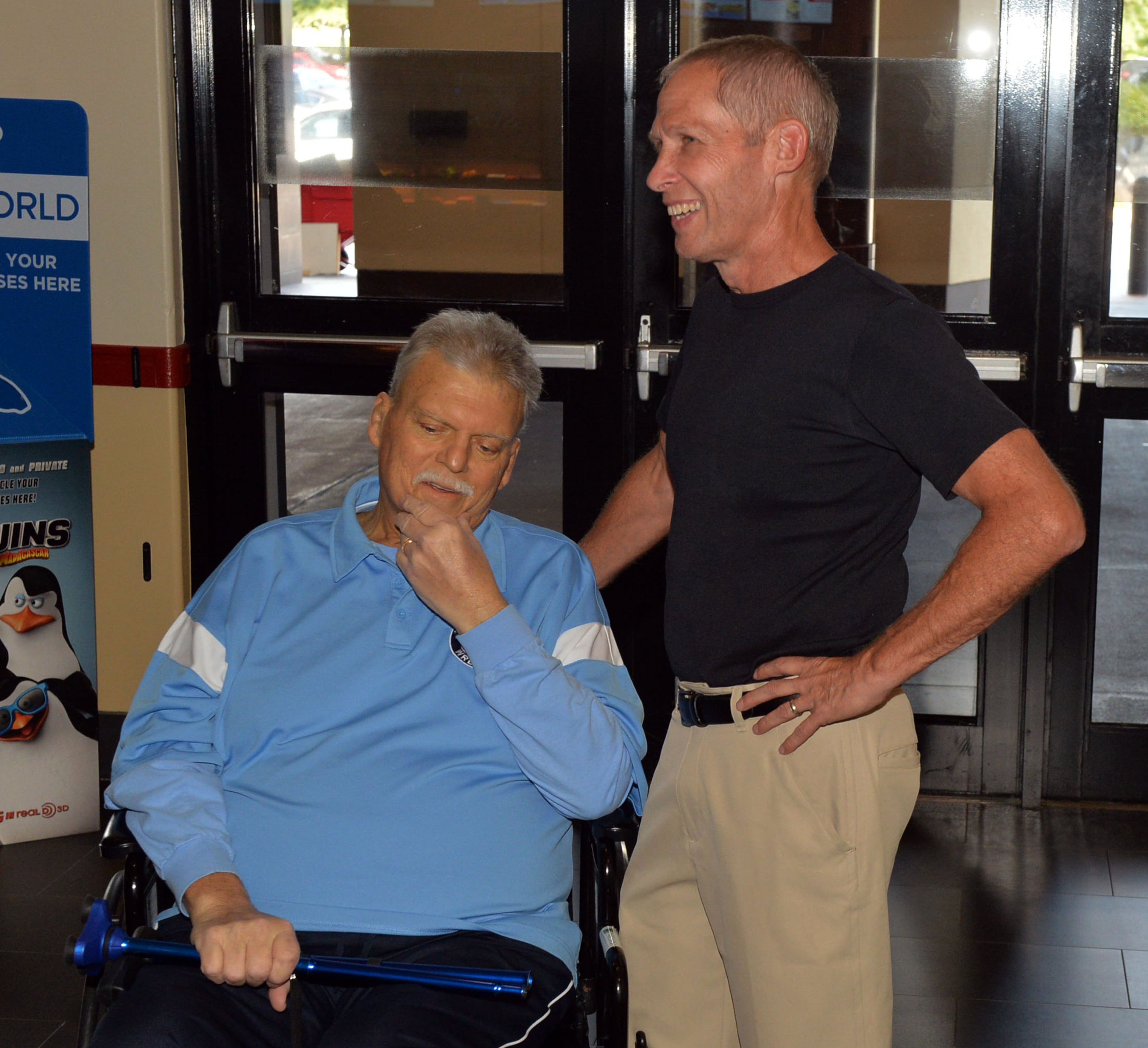 OCTOBER 8, 2014 LAWRENCEVILLE Rich Schumacher and Cliff Ramos, Greater Atlanta Christian wrestling coach, attend an advance screening of the movie "Foxcatcher," at the AMC Colonial Theater in Lawrenceville, Tuesday October 8, 2014. Schumacher, a former nationally-ranked college wrestler in Pennsylvania, became a coach, and brought the Meadowcreek High School wrestling team to its best performance in 20 years. Now Schumacher is dying of pancreatic cancer. KENT D. JOHNSON / KDJOHNSON@AJC.COM