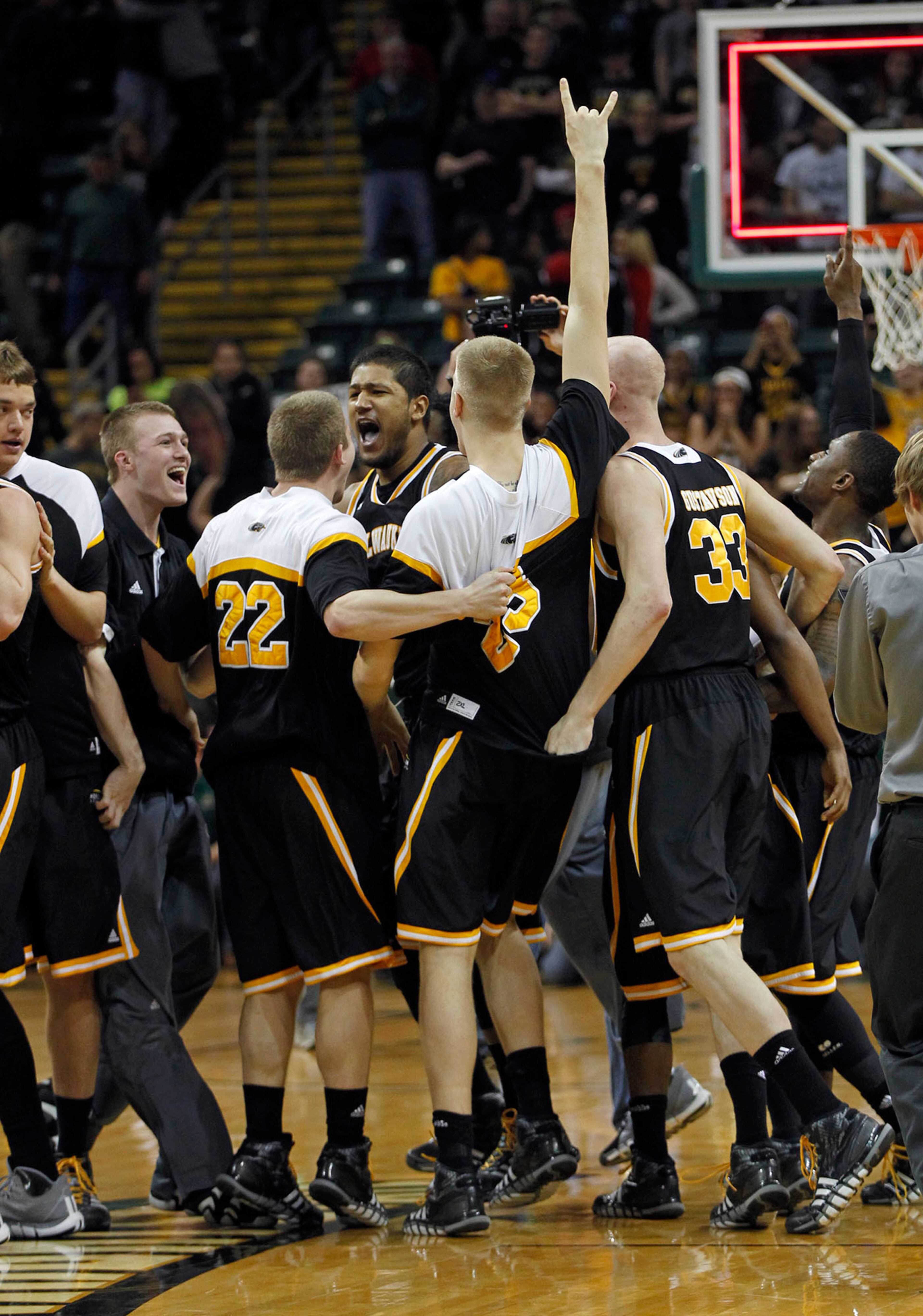 Milwaukee Panthers react as the clock ran out to defeat the Wright State Raiders 69-63 for the Horizon League Championship. TY GREENLEES / STAFF