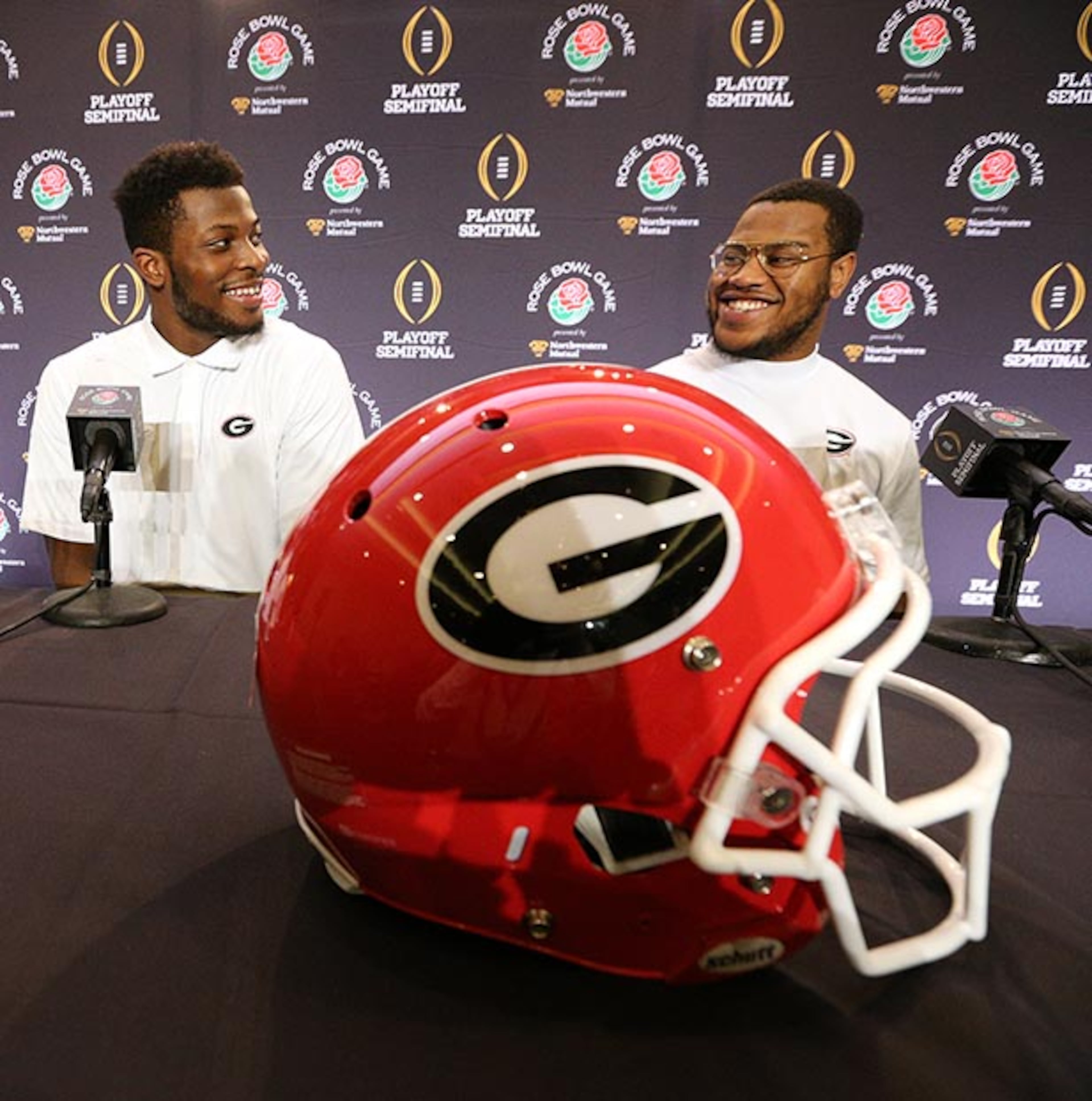 Linebacker Lorenzo Carter (left) and defensive end Jonathan Ledbetter share a laugh while taking questions during the Georgia defensive Rose Bowl press conferences Friday, Dec. 29, 2017, in Los Angeles.