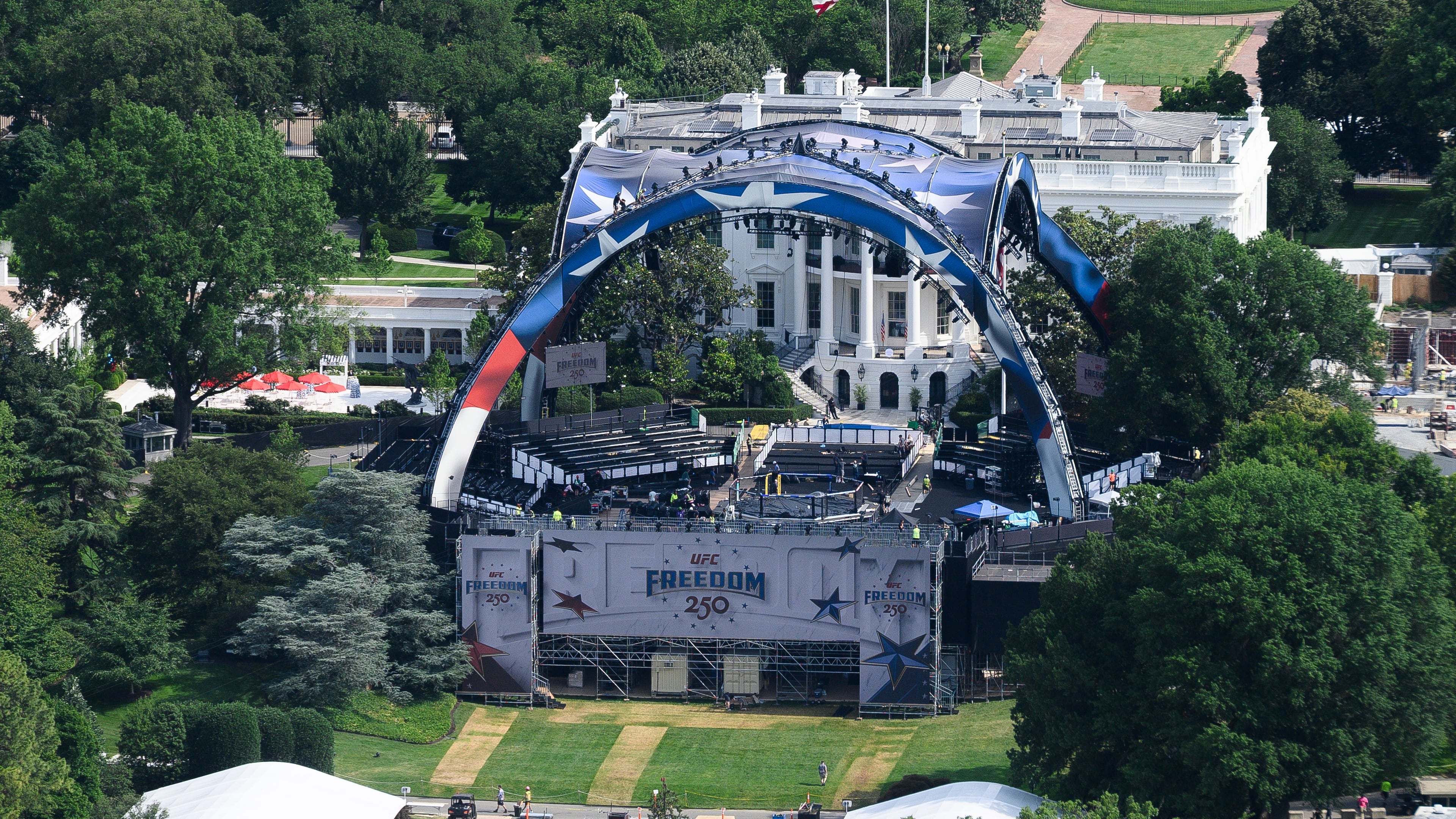 Workers continue building the stage for a future UFC fight on the South Lawn of the White House in Washington, Tuesday, June 9, 2026. (AP Photo/Cliff Owen)