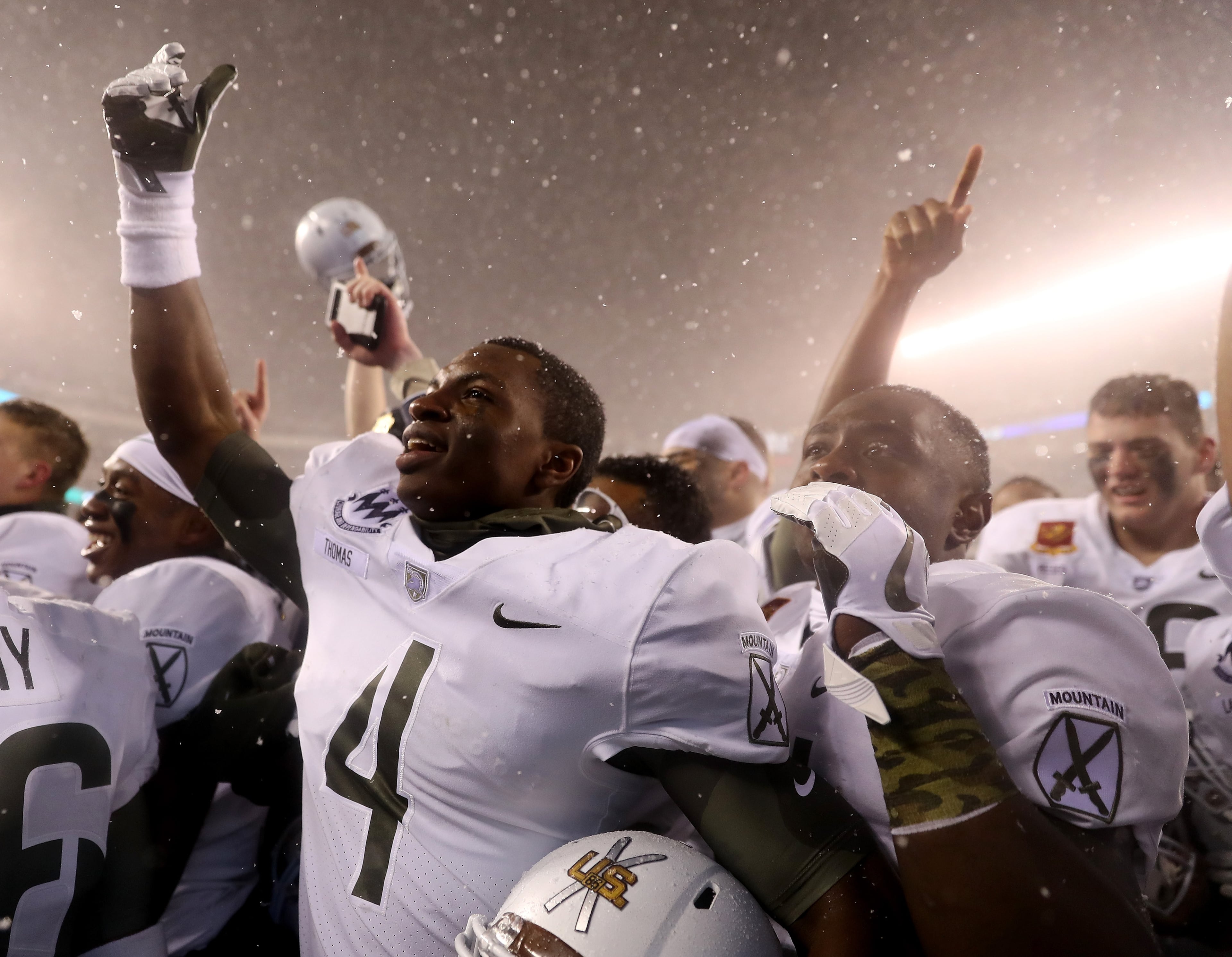 PHILADELPHIA, PA - DECEMBER 09: Cam Thomas #4 of the Army Black Knights and the rest of his teammates celebrate the win over the Navy Midshipmen on December 9, 2017 at Lincoln Financial Field in Philadelphia, Pennsylvania.The Army Black Knights defeated the Navy Midshipmen 14-13. (Photo by Elsa/Getty Images)