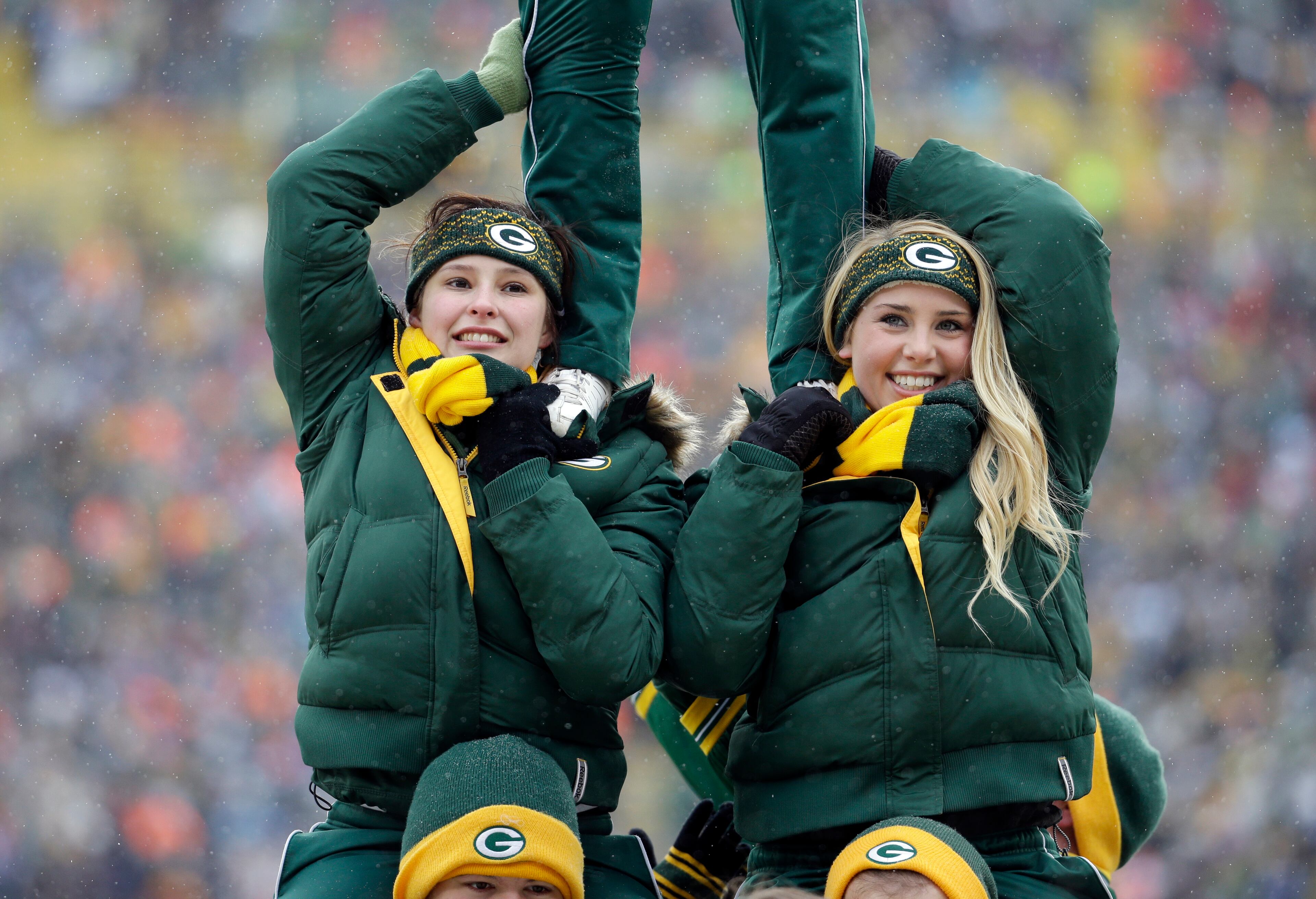 Cheerleaders during the first half of an NFL football game between the Green Bay Packers and the Atlanta Falcons on Dec. 8, 2013, in Green Bay, Wis.