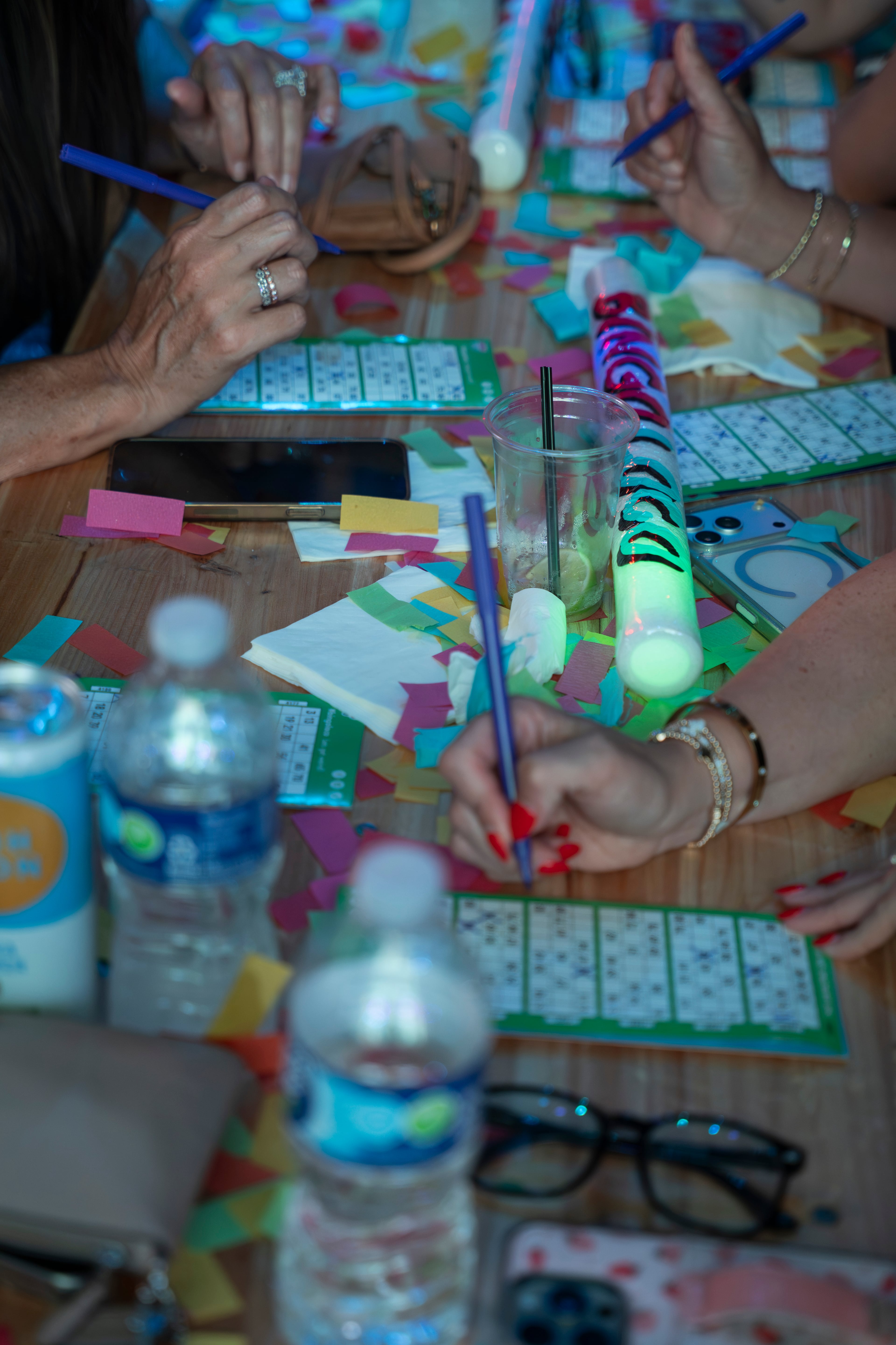 Players fill out their bingo cards during Bingo Loco at Believe Music Hall in Atlanta on Saturday, July 18, 2026. (Olivia Bowdoin for the AJC)