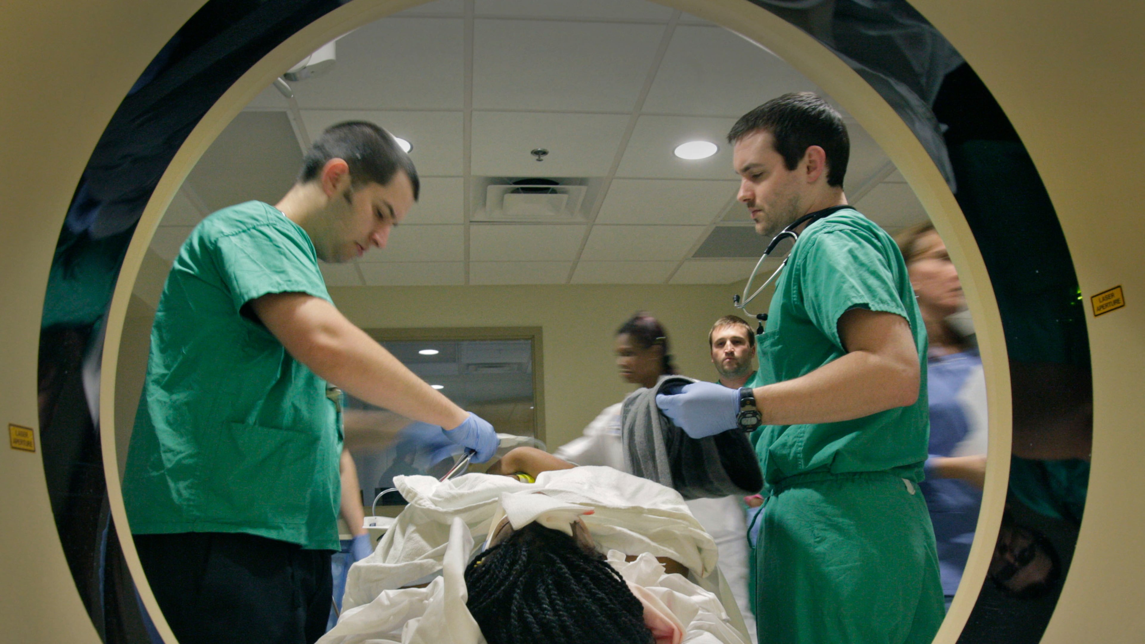 John Dugan, RT (left) and Dr. John Dooley prepare a motor vehicle crash victim for a CT scan at Atlanta Medical Center on March 10, 2011. Bob Andres bandres@ajc.com