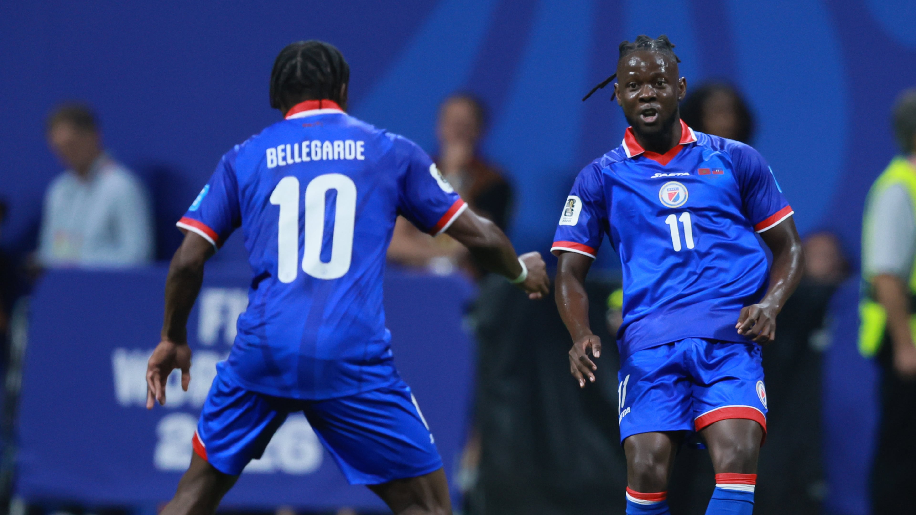 Haiti's Louicius Deedson, right, passes to teammate Jean-Ricner Bellegarde during second half of Morocco vs. Haiti Group C FIFA World Cup match at Atlanta Stadium (Mercedes-Benz Stadium) on Wednesday, June 24, 2026. (Jason Getz/AJC)