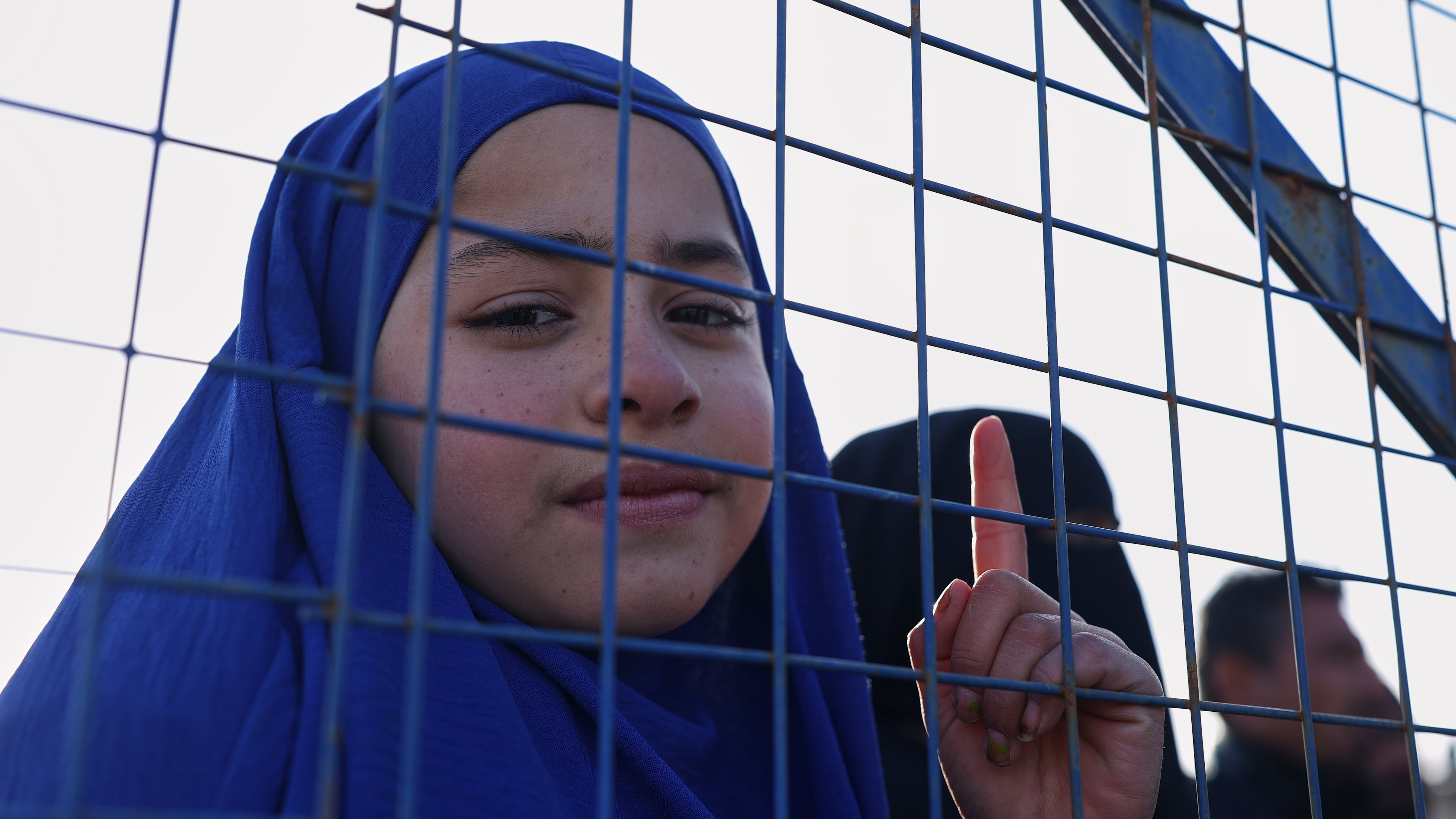 Sundus al-Hassan, 10, poses for a picture inside the al-Hol camp in northeastern Syria's Hasakeh province, Syria, Wednesday, Jan. 21, 2026, after the withdrawal of the Syrian Democratic Forces (SDF). (AP Photo/Ghaith Alsayed)