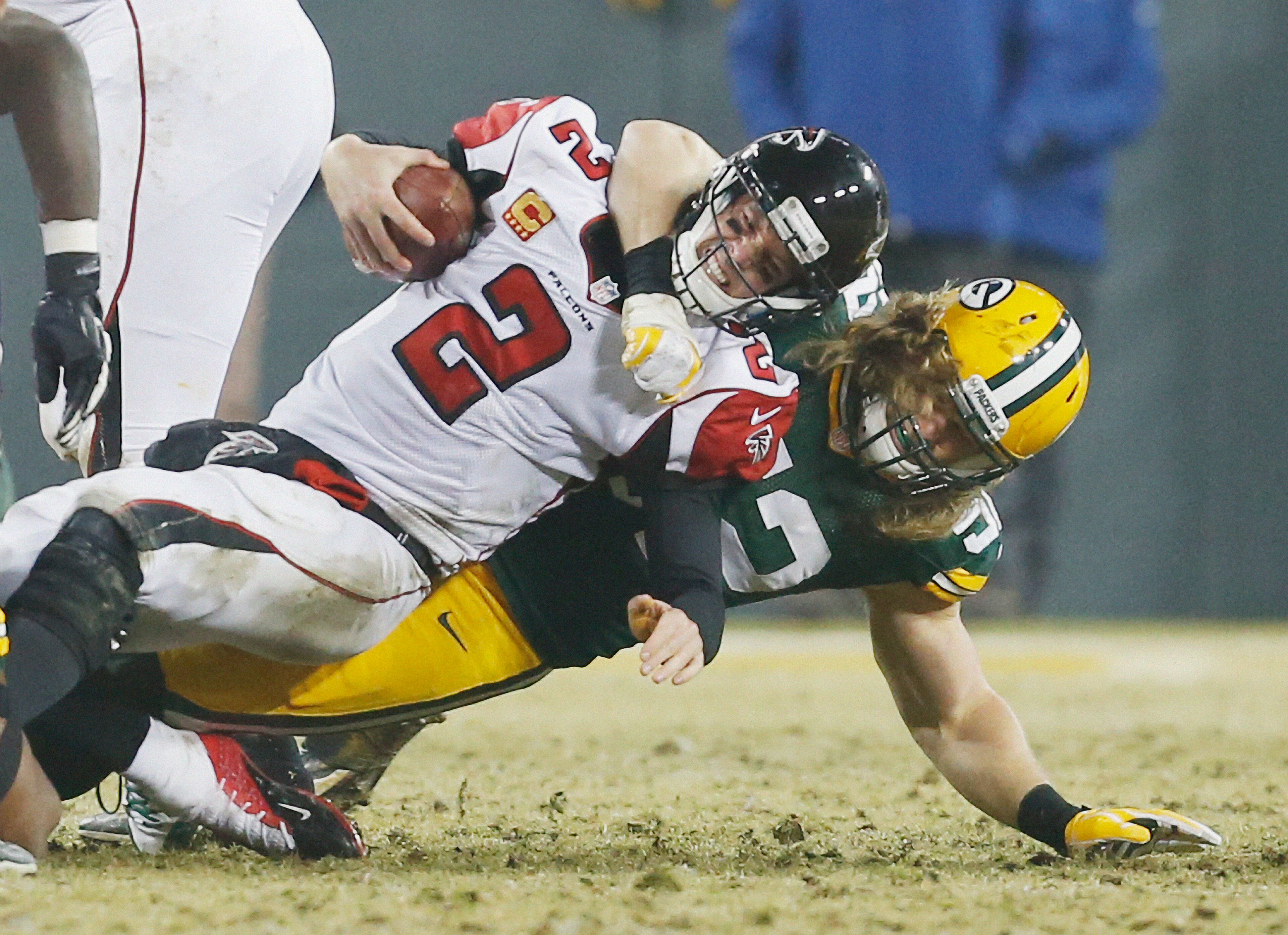 Green Bay Packers' Clay Matthews sacks Falcons quarterback Matt Ryan during the second half of an NFL football game Monday, Dec. 8, 2014, in Green Bay, Wis.