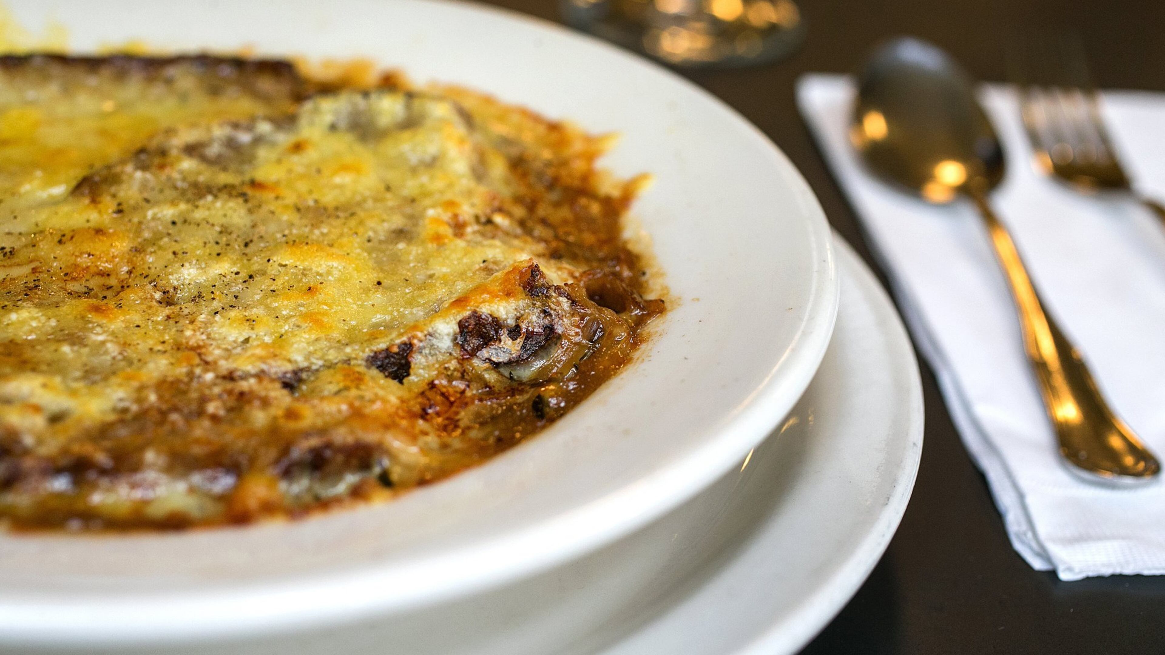 Gratin lyonnais (Lyon-style caramelized onion soup made with chicken stock, sherry and thyme with crouton and gruyere cheese) as prepared by chef Jim Drohman at Le Pichet on Friday, Feb. 3, 2017, in Seattle. (Johnny Andrews/Seattle Times/TNS)