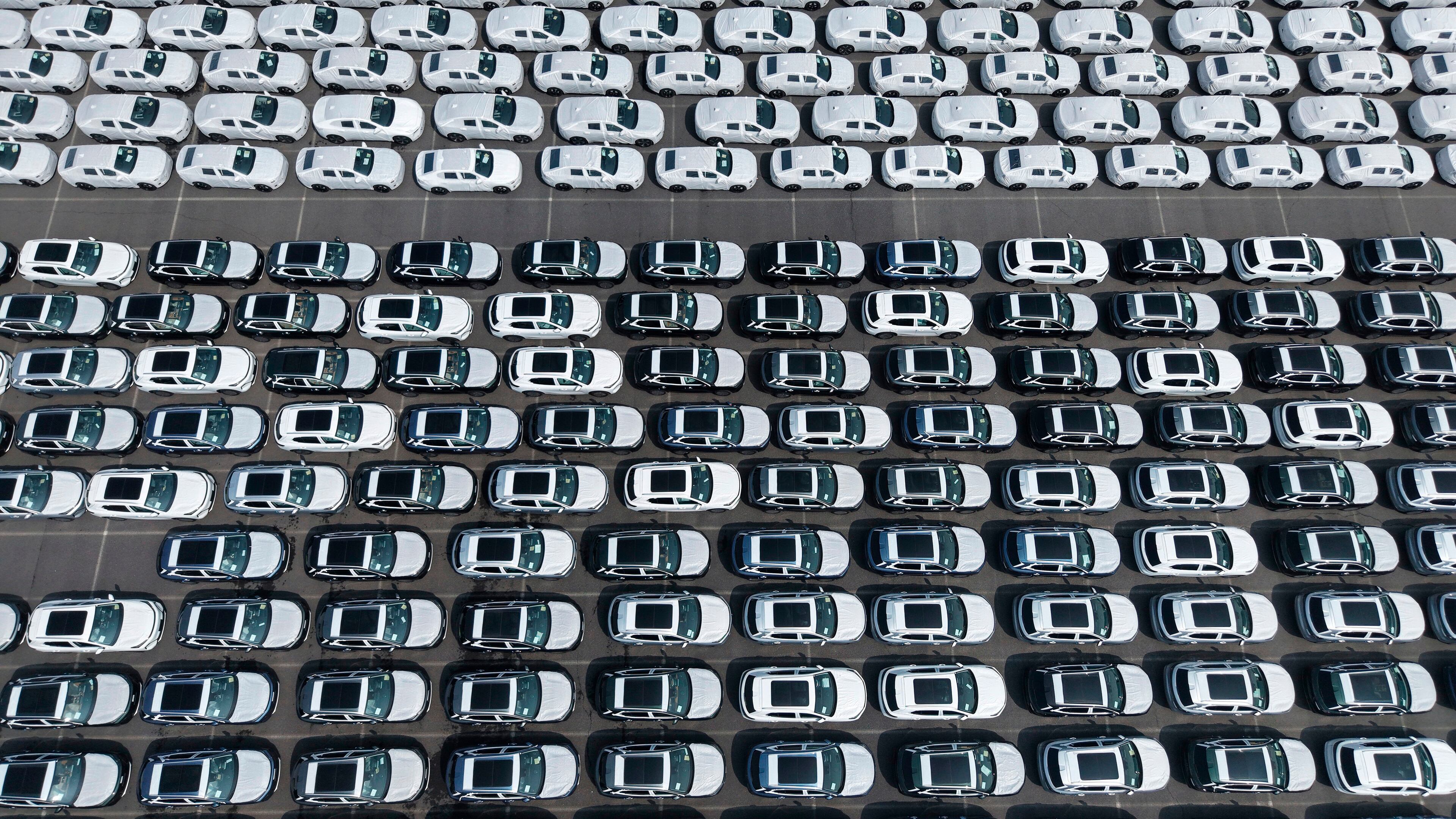 Aerial view of new vehicles waiting for shipment to overseas market at a port in Shanghai, China Saturday, May 9, 2026. (Chinatopix via AP)