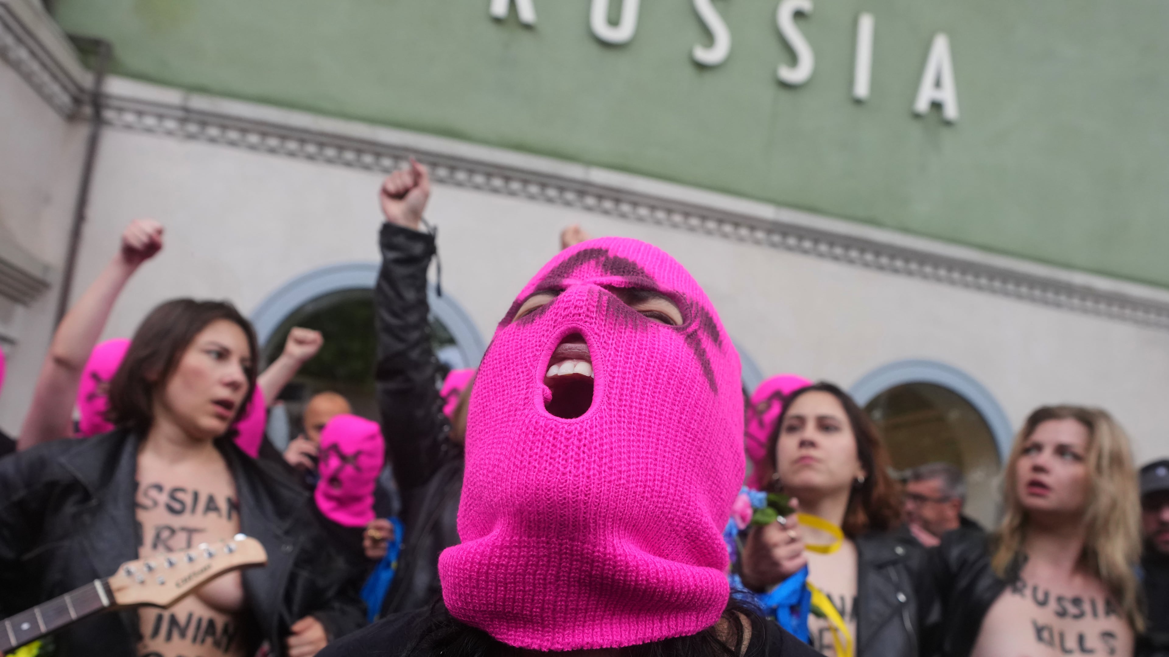 Pussy Riot and FEMEN activists stage a protest against Russia's presence after its absence following the 2022 invasion of Ukraine in front of the Russian pavilion, at the 2026 Art Venice Biennale, in Venice, Italy, Wednesday, May 6, 2026. (AP Photo/Luca Bruno)