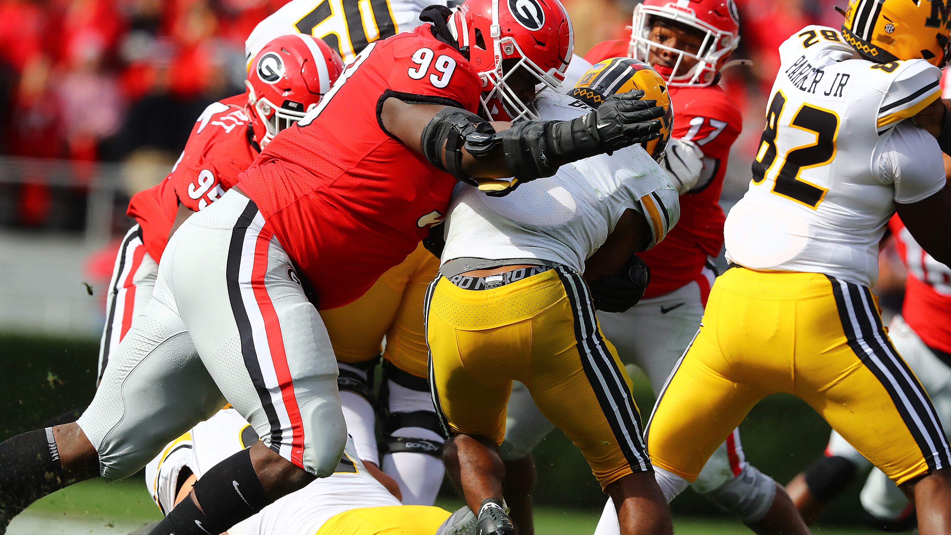 Georgia's Jordan Davis levels Missouri running back Tyler Badie for a loss on Nov. 6. “Curtis Compton / Curtis.Compton@ajc.com”
