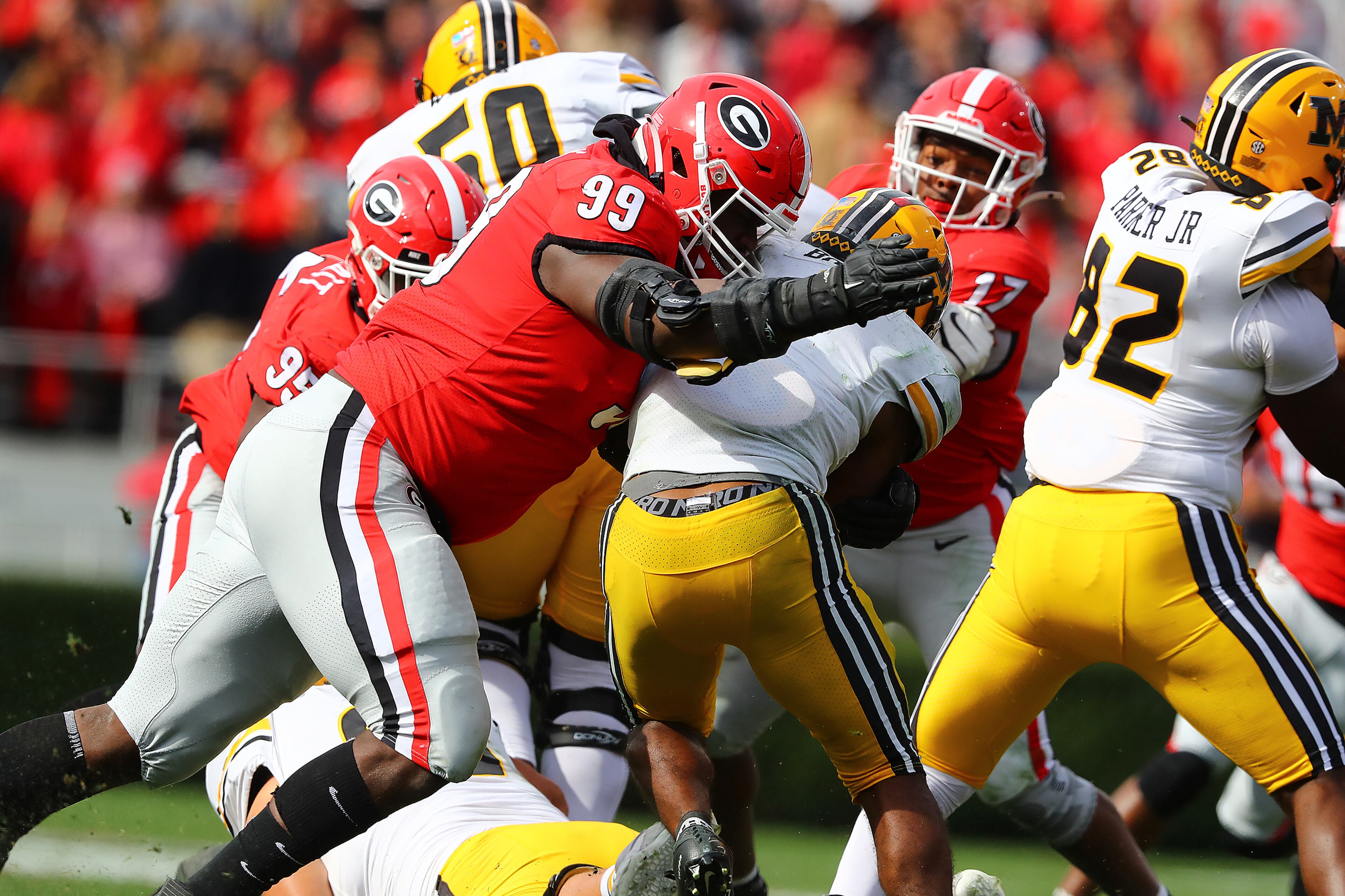 Georgia defensive lineman Jordan Davis levels Missouri running back Tyler Badie behind the line of scrimmage for a loss during the third quarter in a NCAA college football game on Saturday, Nov. 6, 2021, in Athens. “Curtis Compton / Curtis.Compton@ajc.com”