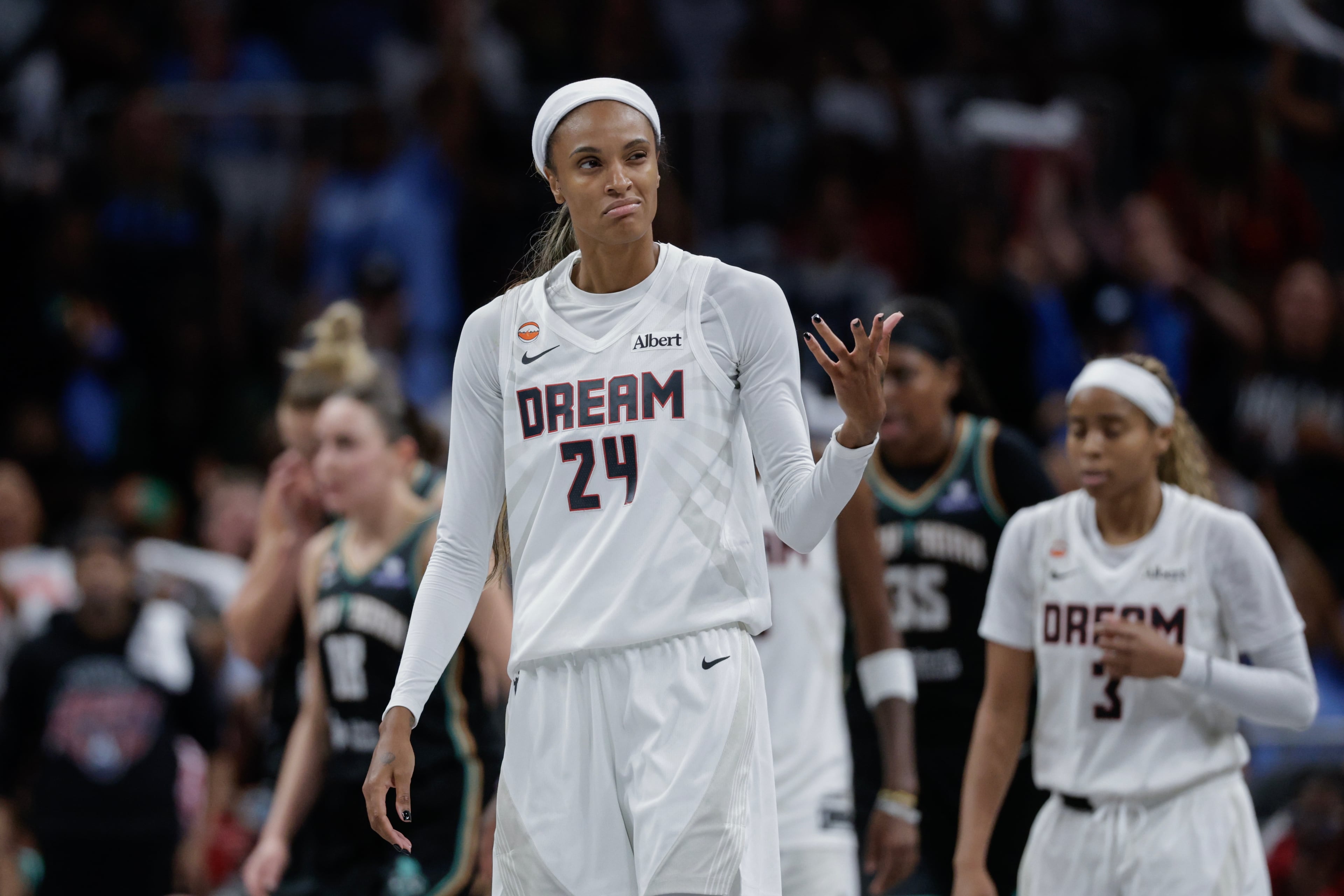 Atlanta Dream forward DeWanna Bonner (24) gets the fans involved during the second half of a WNBA semifinal playoff game 1 between the Atlanta Dream and the New York Liberty, Sunday, Oct. 4, 2026, in Atlanta. (Erik S. Lesser for the AJC)