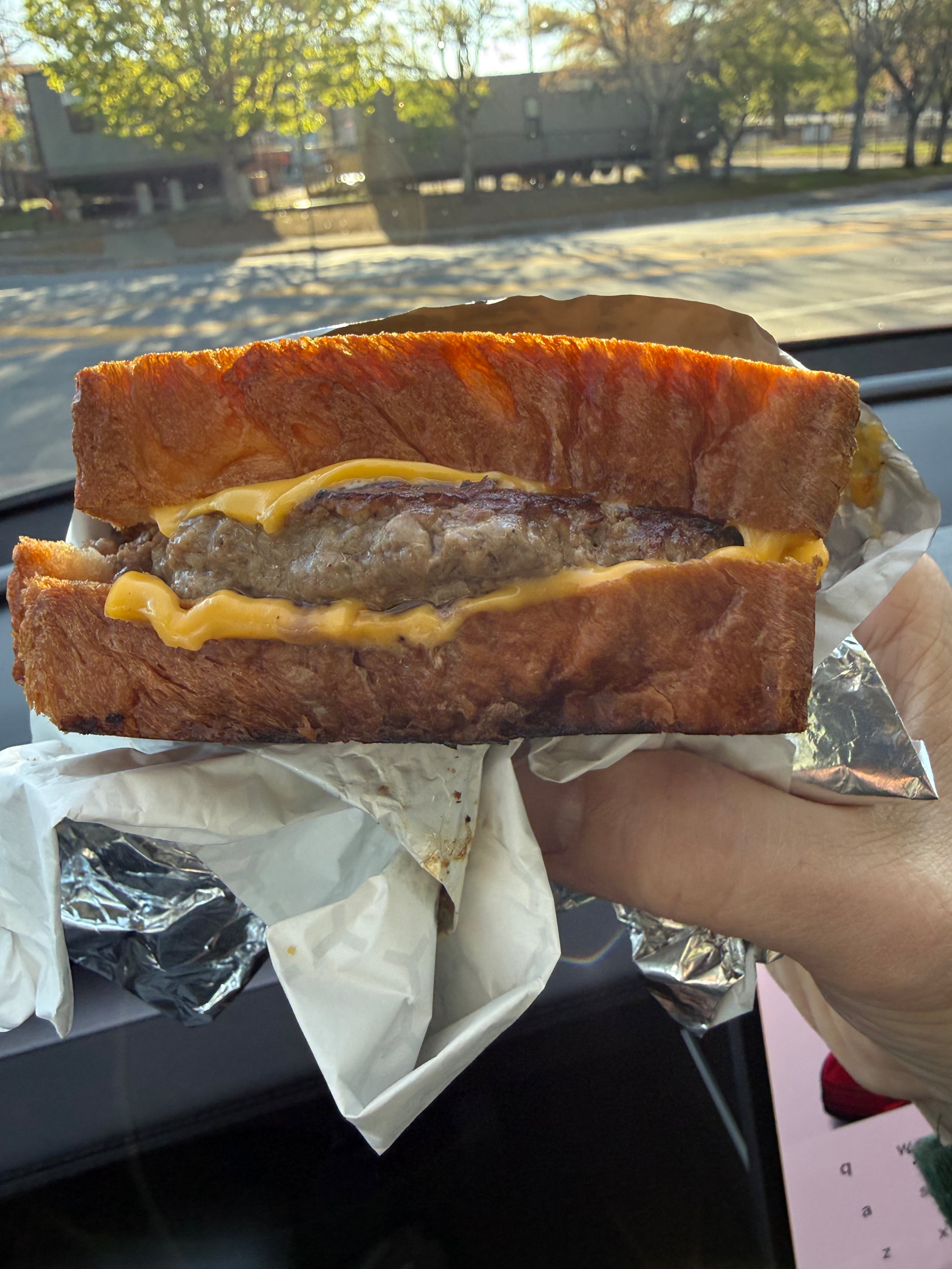 Dank's Deli’s Coca-Cola jelly, bacon and truffle gouda cheeseburger. (Courtesy of Dank's Deli)