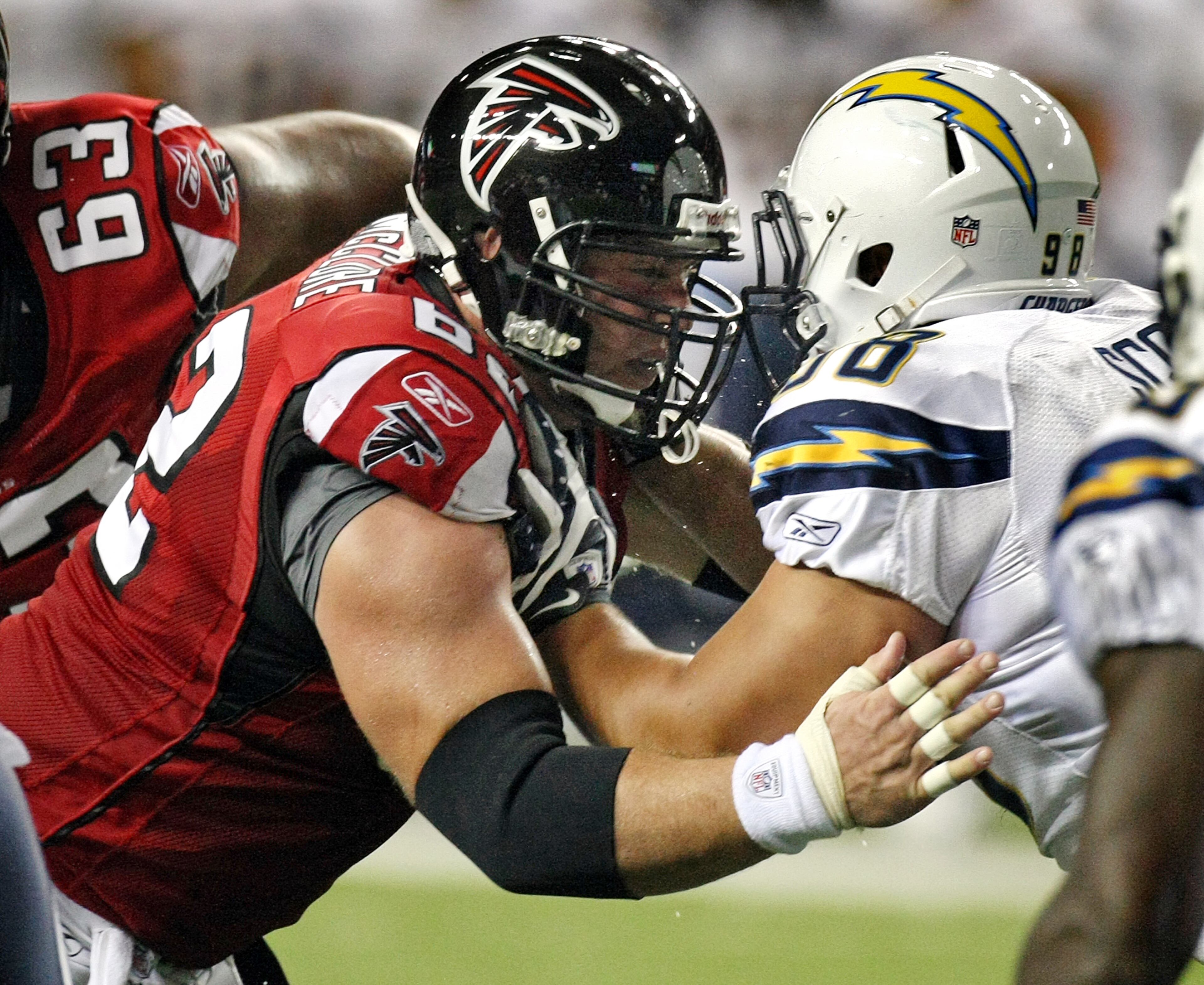 Falcons center Todd McClure (left) blocks Chargers' Ian Scott in 2009. Curtis Compton, ccompton@ajc.com