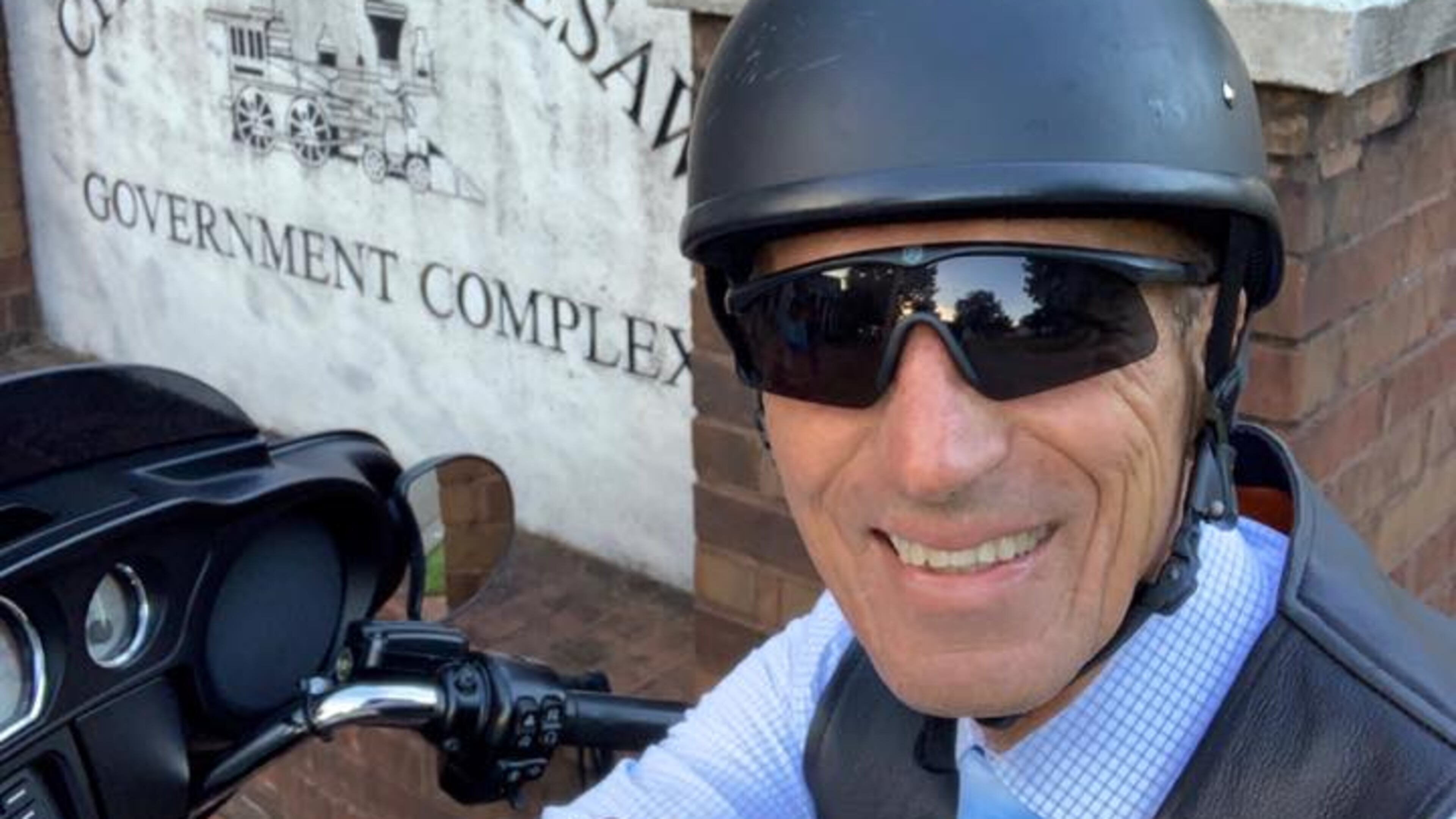 Kennesaw Mayor Derek Easterling poses in front of City Hall for his selfie. #CityHallSelfie Day will be held on Aug. 14 by Kennesaw. (Courtesy of Kennesaw)