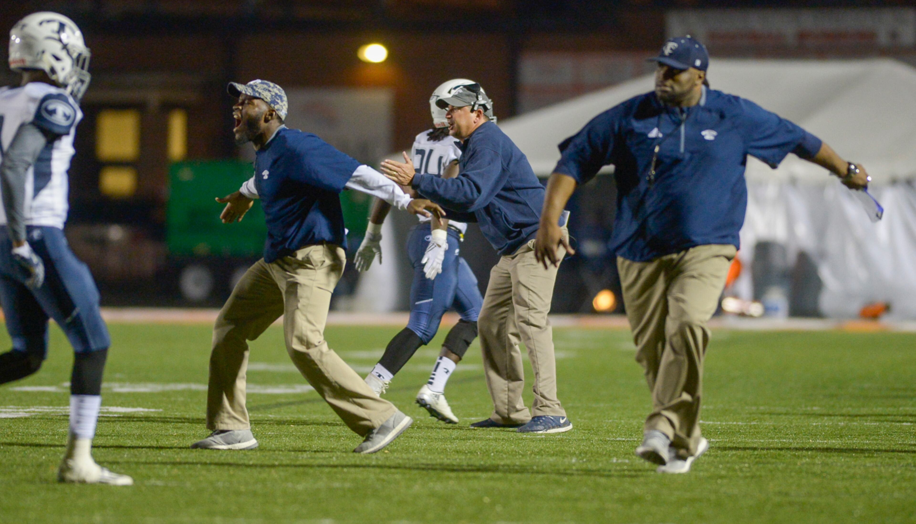 The Blue Devils' coaches and players celebrate after a play during the second half of their game at North Cobb in the first-round of playoffs Friday November 11, 2016. SPECIAL/Daniel Varnado
