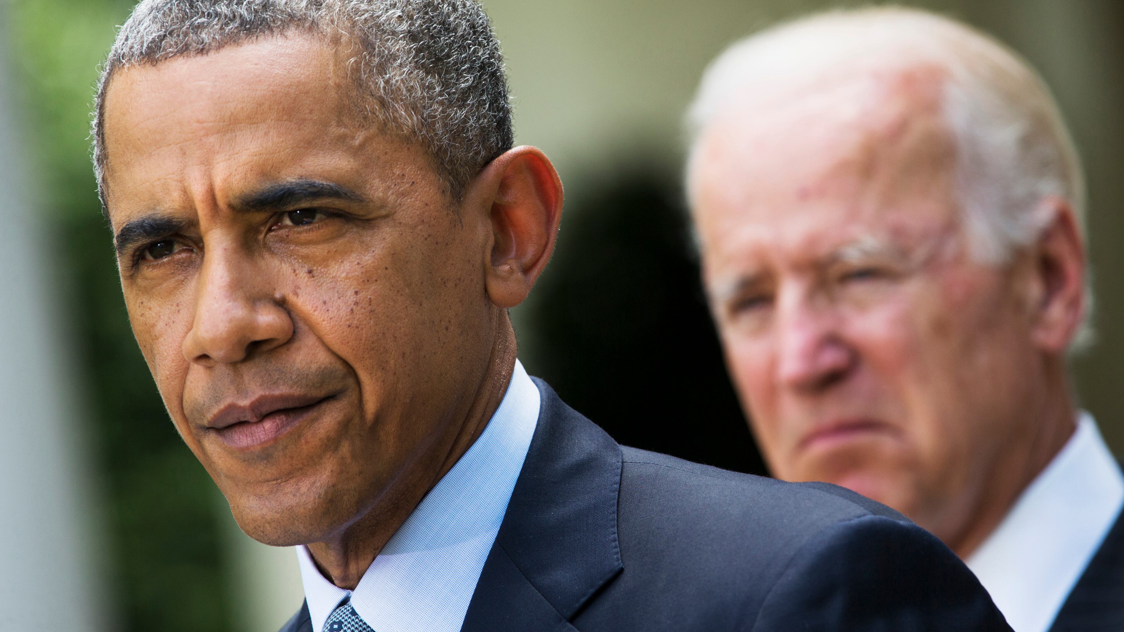 FILE - In this June 30, 2014, file photo, President Barack Obama, accompanied by Vice President Joe Biden, pauses while making a statement about immigration reform, in the Rose Garden of the White House in Washington. Obama over time has been embraced and scorned by immigrant advocates who have viewed him as both a champion and an obstacle to their cause. (AP Photo/Jacquelyn Martin, File)
