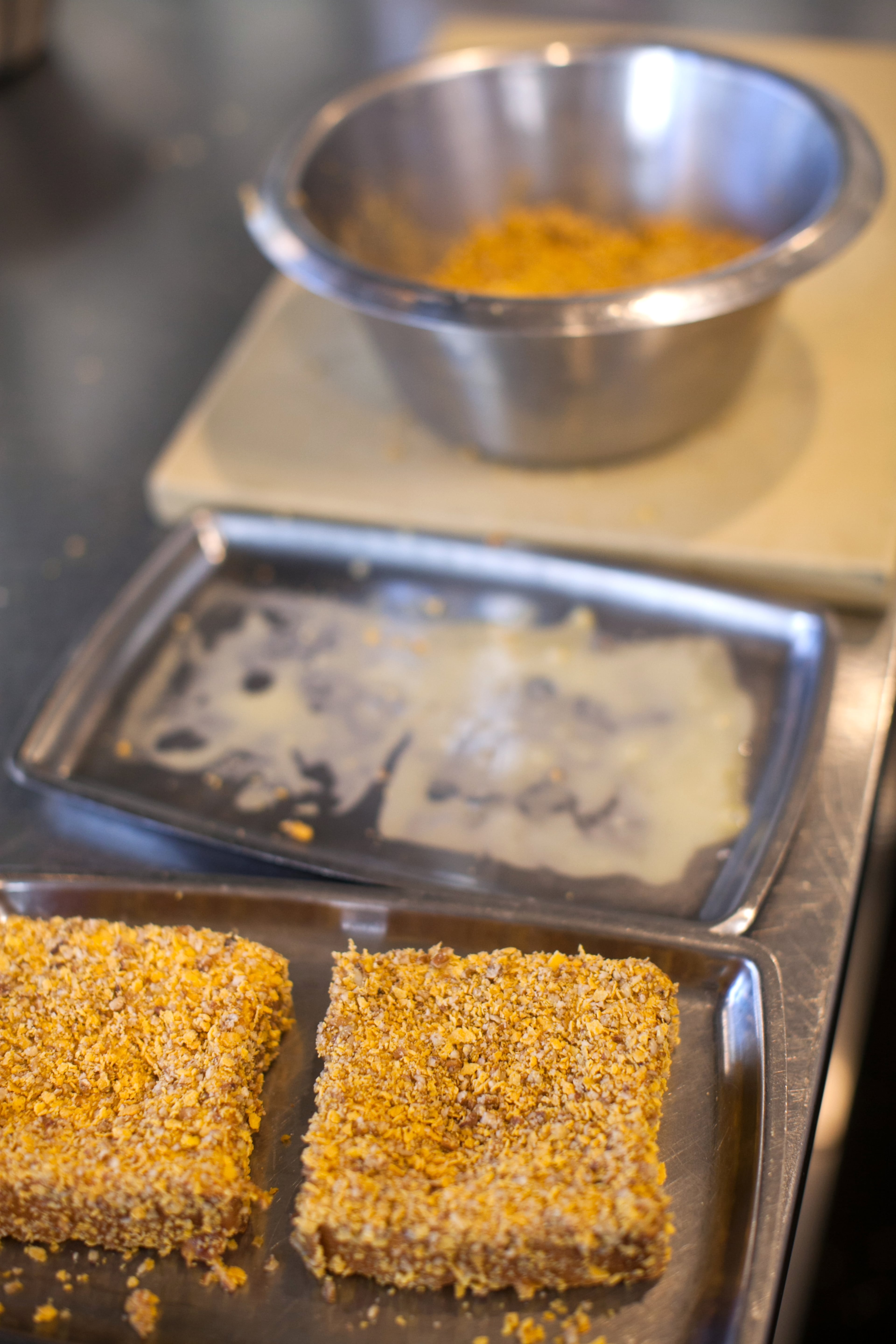 After being dredged in the egg mixture slices of challah are then placed in a cornflake-pecan mixture. (styling by Chef Todd Ginsberg) (Photography by Renee Brock/Special)