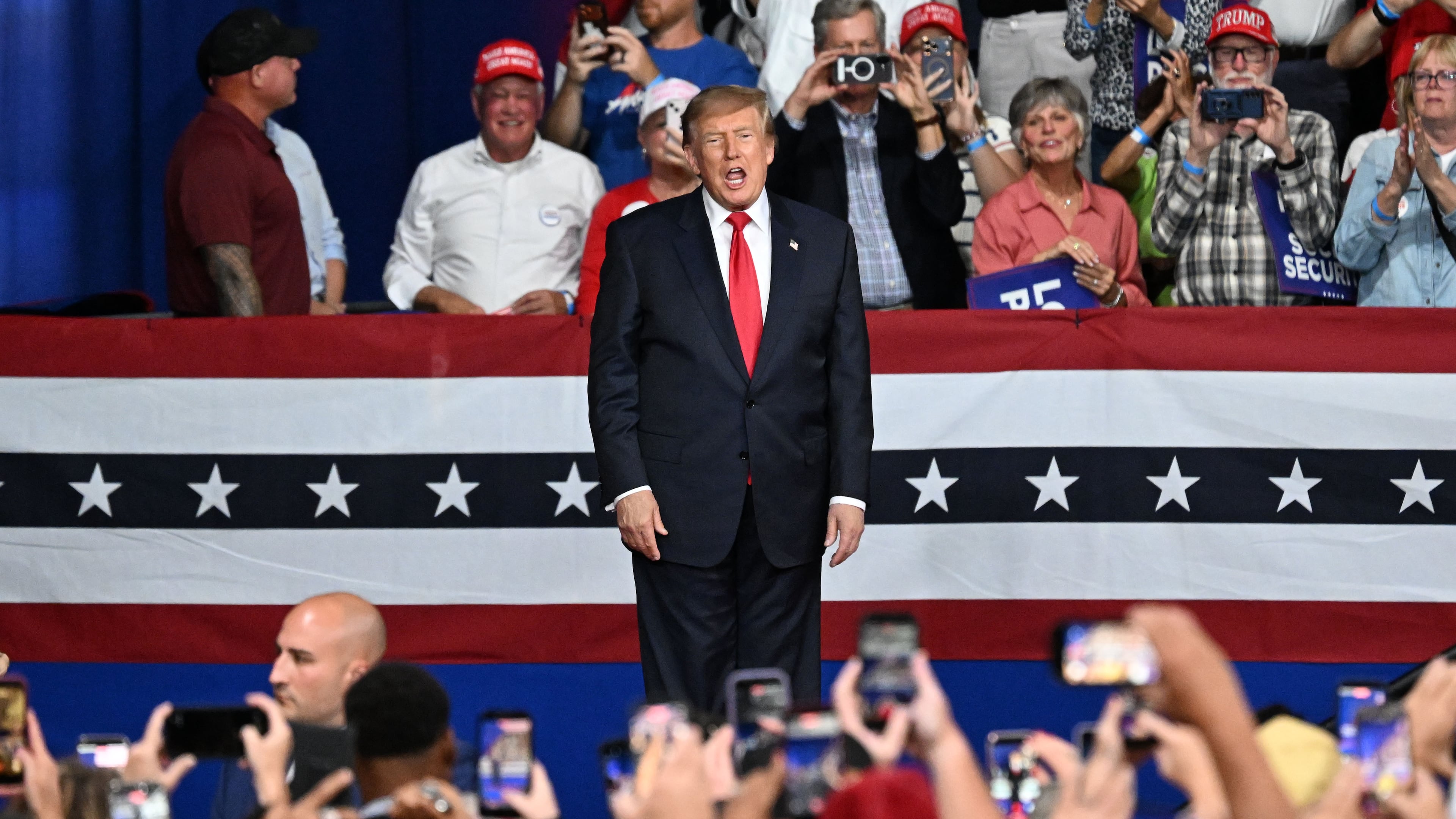 President Donald Trump takes the stage during a campaign rally at Guardian Centers in Perry on Saturday. (Hyosub Shin/AJC)