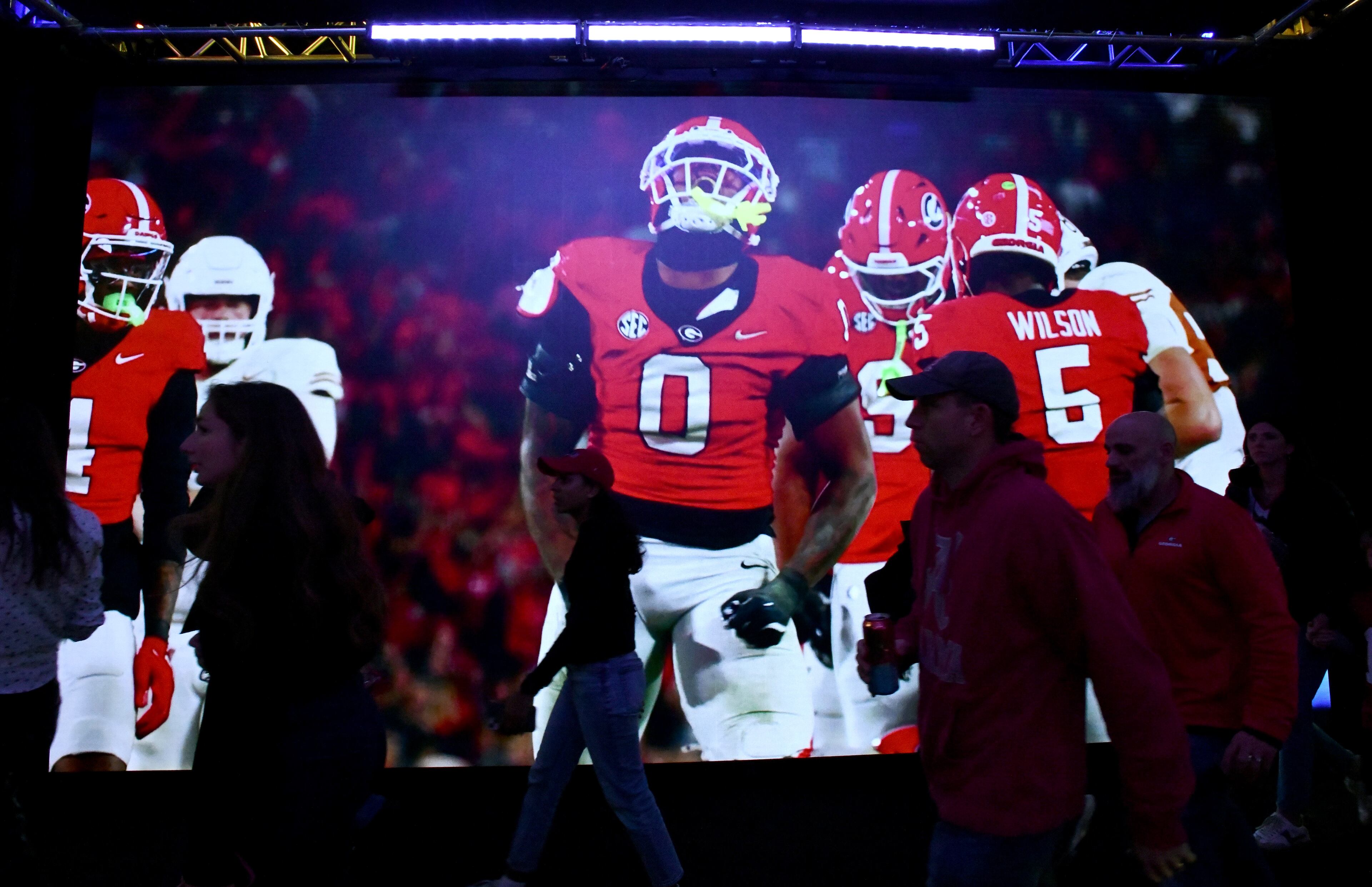 Fans enter for The Dr Pepper SEC FanFare ahead of the SEC Championship football game between Georgia and Alabama, Saturday, Dec. 6, 2025 in Atlanta. (Hyosub Shin/AJC)