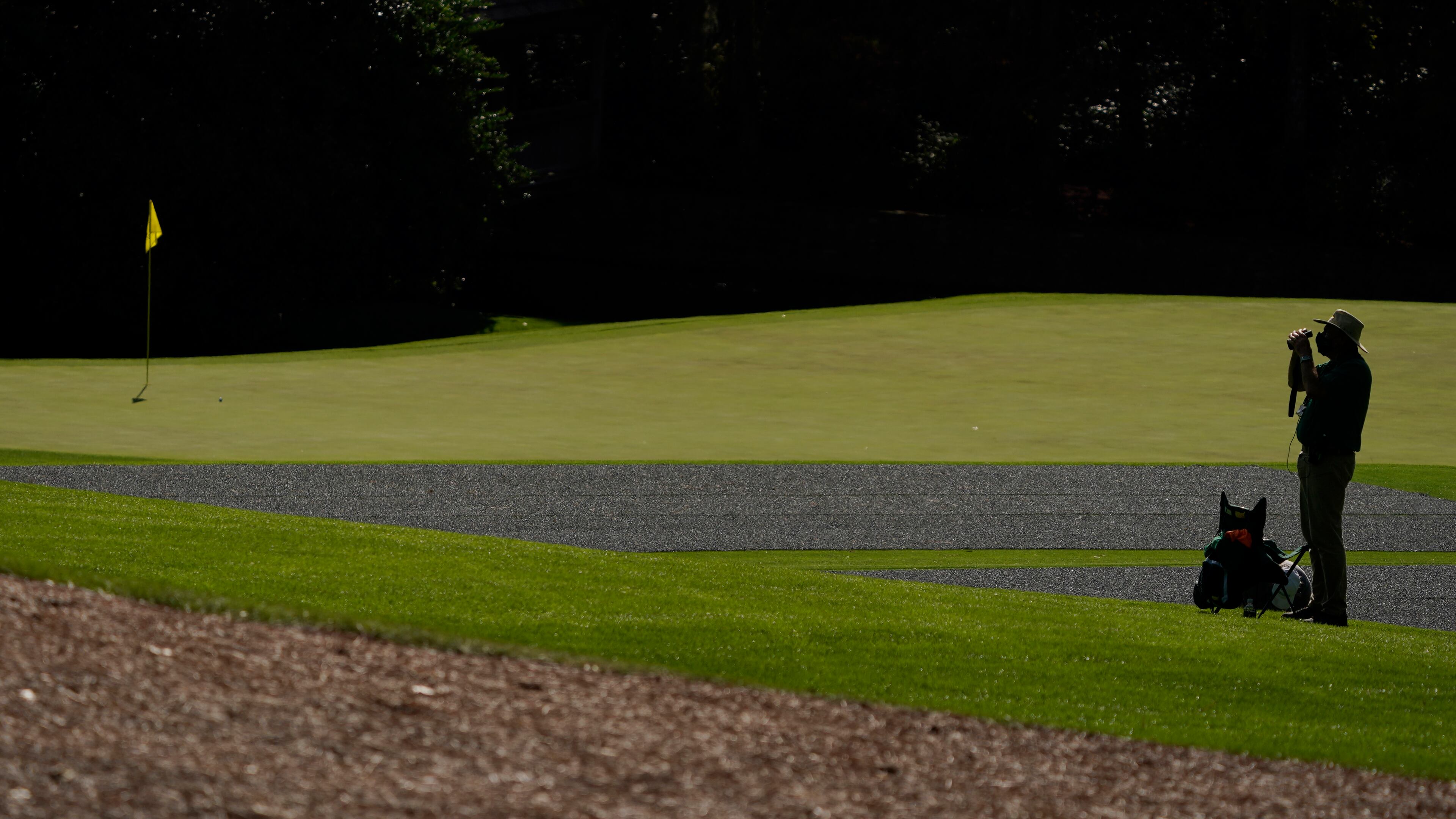 A course marshall watches for golfers on the 11th fairway during a practice round for the Masters Tournament Monday, Nov. 9, 2020, in Augusta, Ga. (Charlie Riedel/AP)
