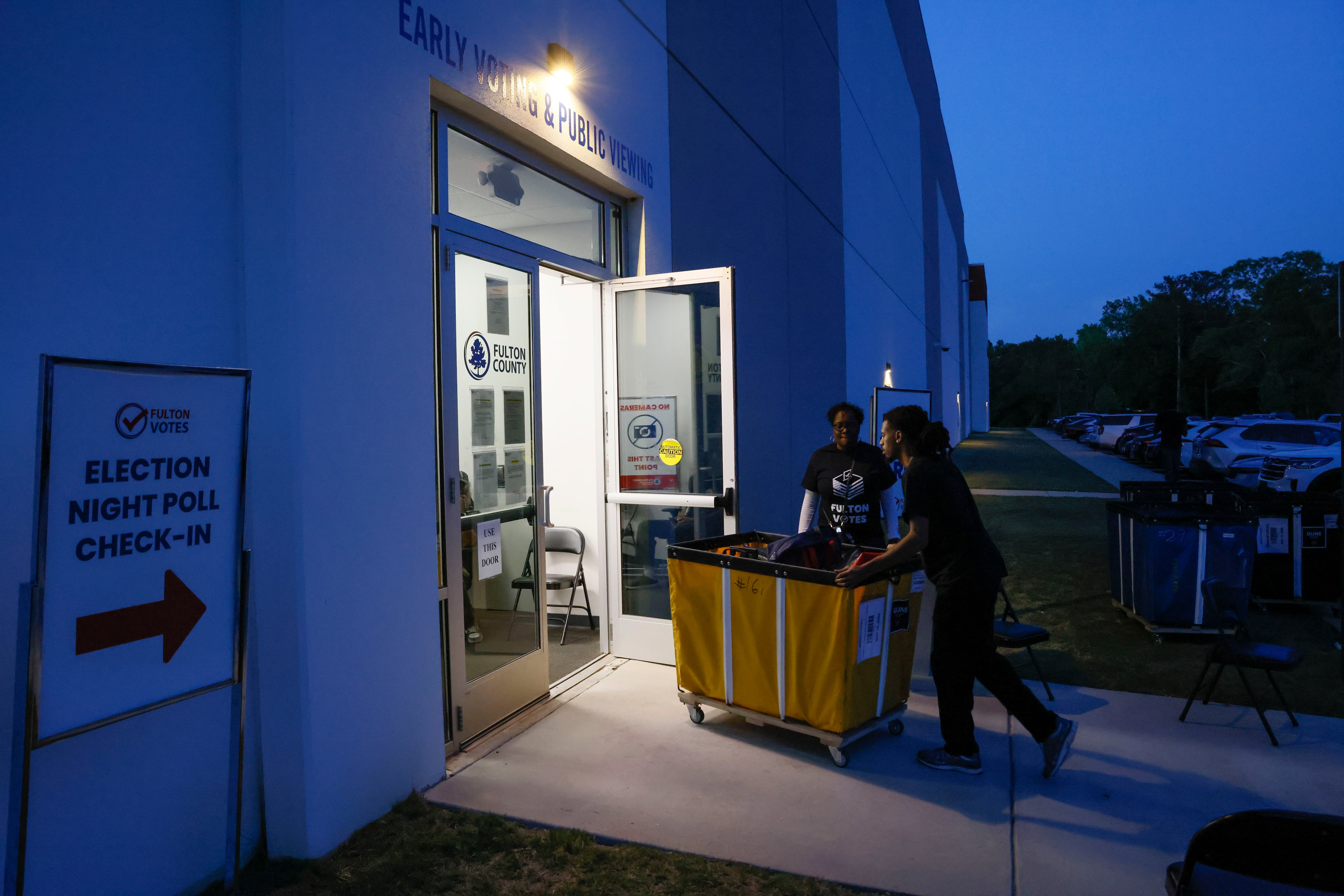 Poll workers deliver ballots at the Fulton County Election Center, in Atlanta on Tuesday, May 19, 2026, during the 2026 Georgia primary elections.(Bob Andres for the AJC)