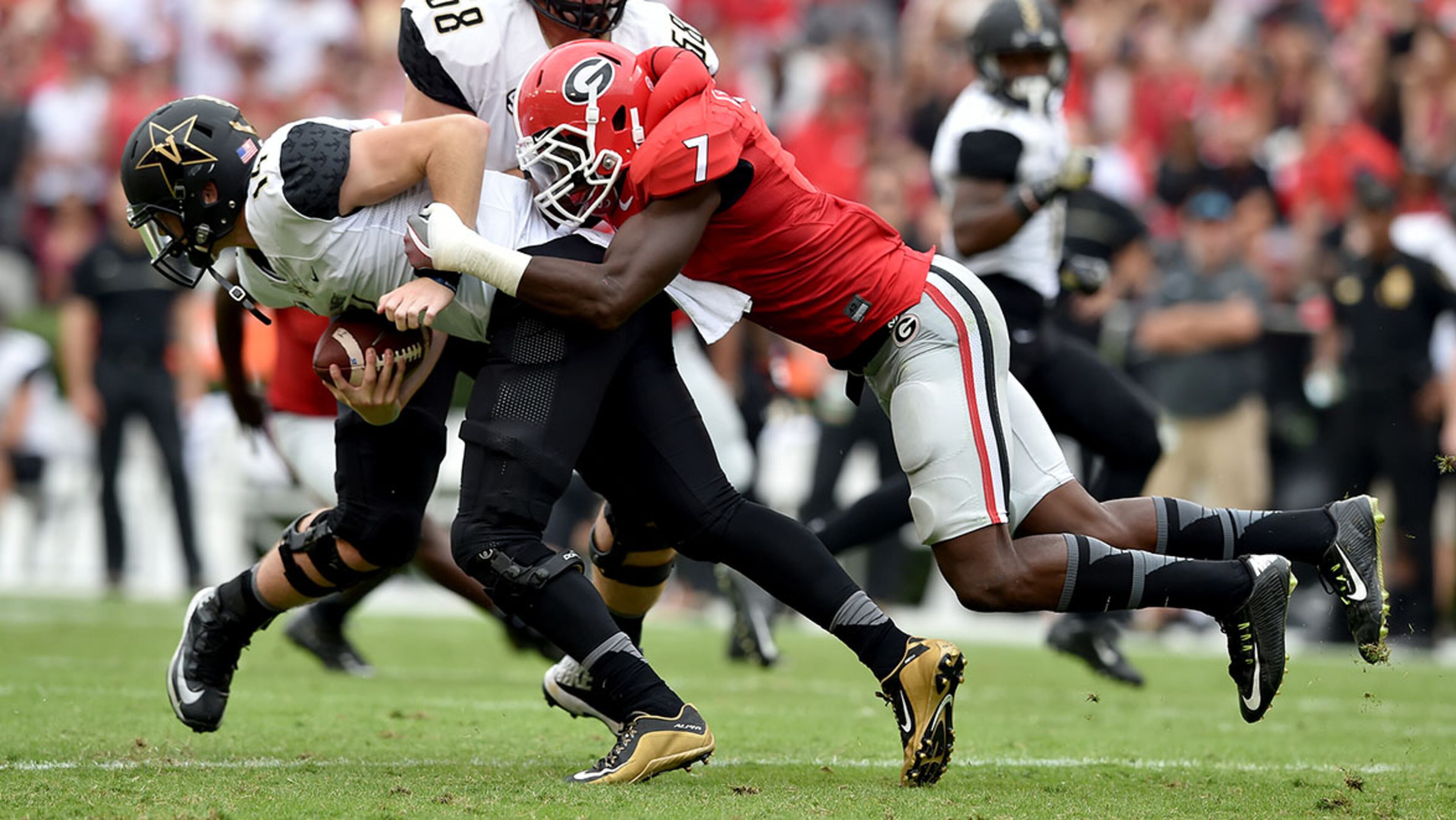 October 15, 2016 Athens, GA: Georgia Bulldogs linebacker Lorenzo Carter sacks Vanderbilt Commodores quarterback Vanderbilt Commodores quarterback Kyle Shurmur during the first half at Sanford Stadium Saturday October 15, 2016. BRANT SANDERLIN/BSANDERLIN@AJC.COM