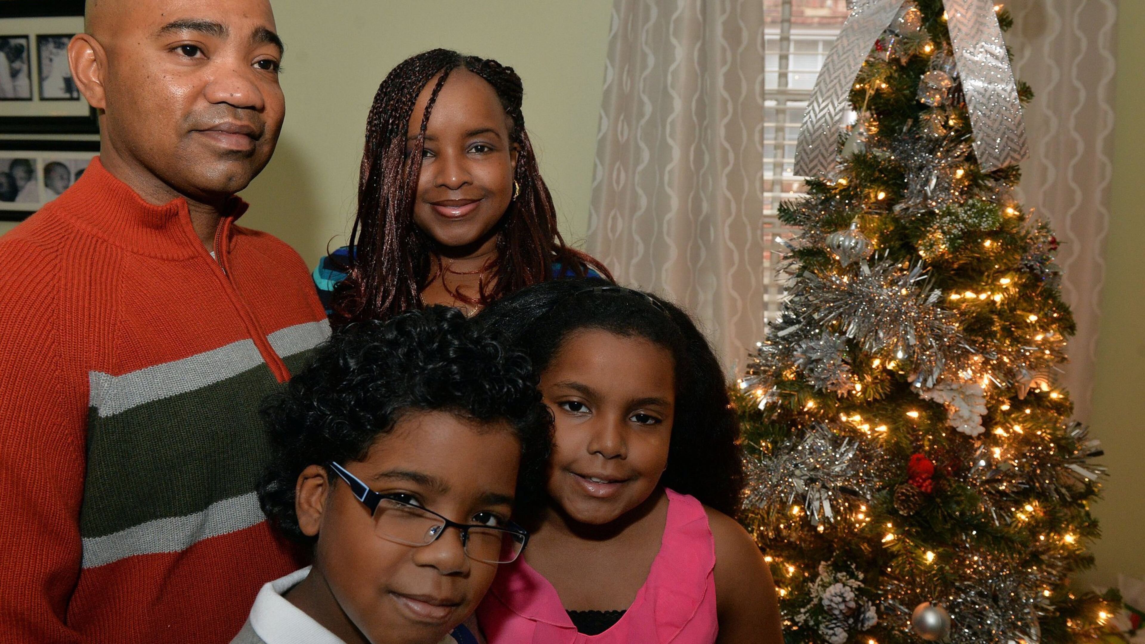 Damion Roman, a sergeant in the Georgia Army National Guard, is home in time for Christmas. His deployment ended early. He rejoined his family on Tuesday at a ceremony in Toccoa. Now, back home, he was in the kitchen on this Christmas Eve, doing something dad has traditionally done: He’ll be making dumplings. He’s shown with his wife, Stacey, and their 9-year-old twins, Nathaniel and Anaya in their Stone Mountain home. KENT D. JOHNSON / KDJOHNSON@AJC.COM