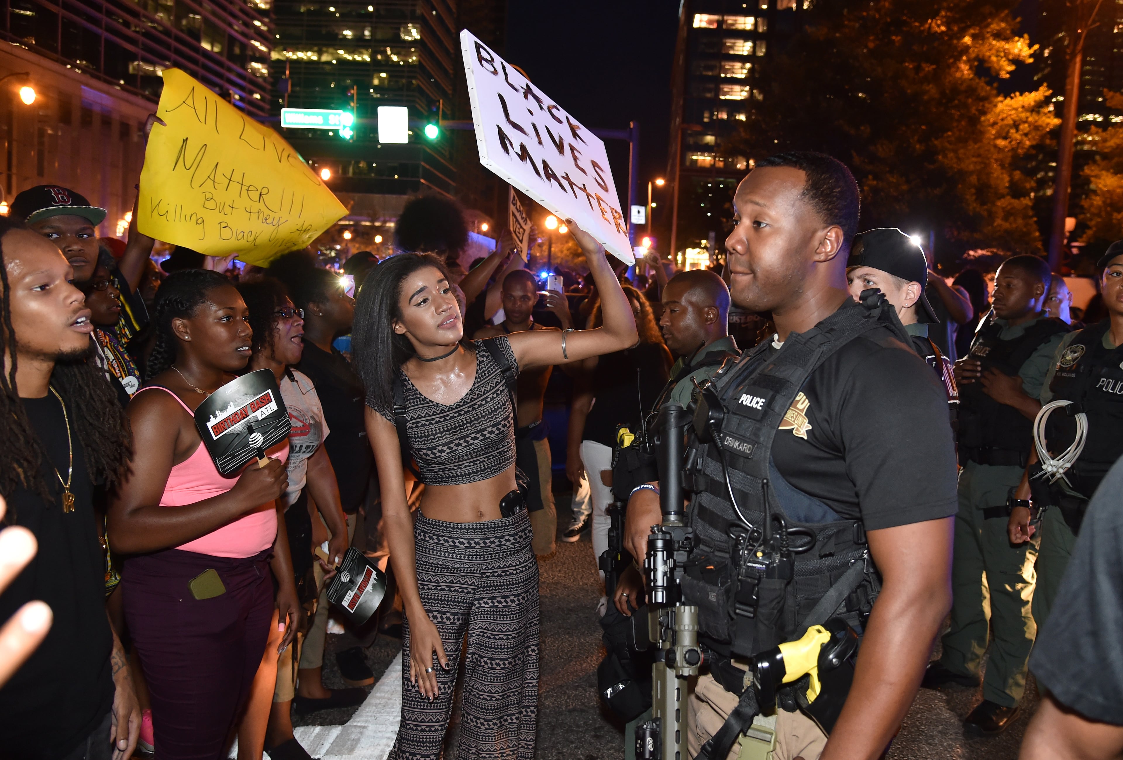 Protesters confront police officers on Williams Street. Police blocked protesters from walking onto the downtown connector Friday night. Thousands gathered in the streets of Atlanta Friday July 8, 2016, to protest the recent police shootings that have happened around the country. The group gathered outside the National Center for Civil and Human Rights before marching to Centennial Olympic Park and surrounding streets.
