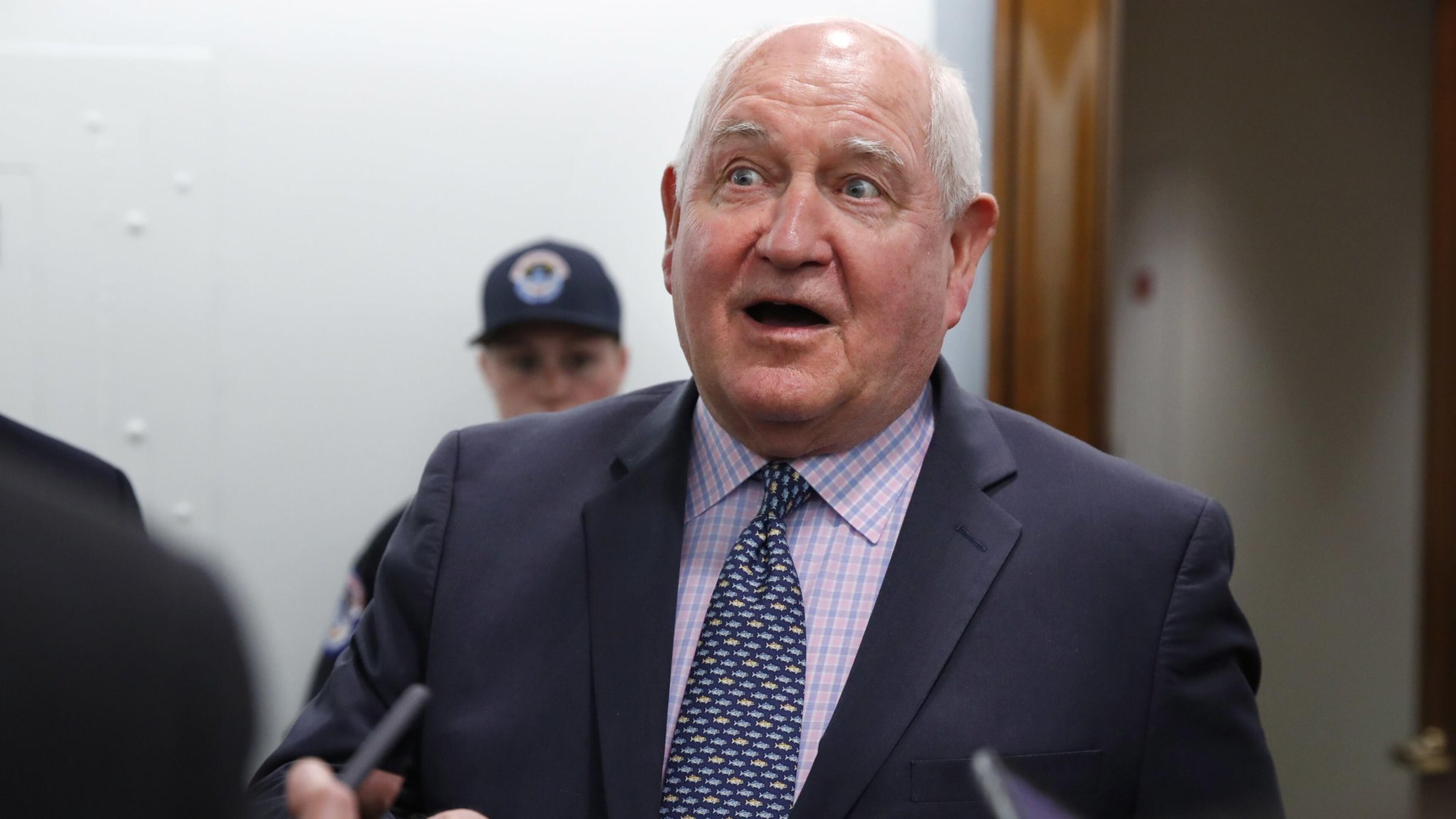 In this April 11, 2018, file photo, Agriculture Secretary Sonny Perdue speaks with reporters on Capitol Hill in Washington. The Trump administration is setting out to accomplish what this year’s farm bill didn’t: Tighten work requirements for millions of Americans who receive federal food assistance. (AP Photo/Jacquelyn Martin, File)